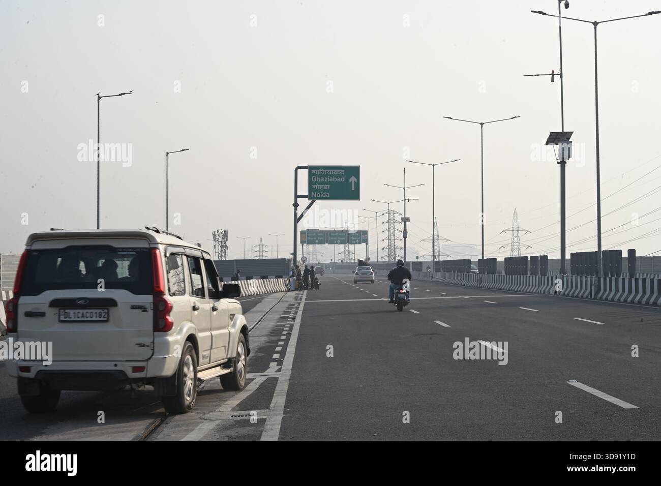 NEW DELHI, INDIA - DECEMBER 1: Traffic seen on Saharanpur Dehradun Expressway as it is open for Public Trial from last night, on December 1, 2025 in New Delhi, India. Once completed, the 210 km high-speed corridor is expected to reduce the travel time between Delhi and Dehradun from the current 6 to 6.5 hours to just 2 to 2.5 hours, significantly improving connectivity between the national capital, western Uttar Pradesh, and Uttarakhand. Authorities are preparing to inaugurate a 32 km-long completed section of the expressway between late December and early January, even as work continues at an Stock Photo