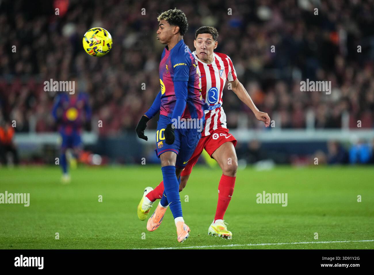 Barcelona, Spain. 03rd Dec, 2025. Lamine Yamal of FC Barcelona and Nahuel Molina of Atletico de Madrid during the La Liga EA Sports match between FC Barcelona and Atletico de Madrid played at Spotify Camp Nou Stadium on December 2 2025 in Barcelona, Spain. (Photo by Bagu Blanco/PRESSIN) Credit: PRESSINPHOTO SPORTS AGENCY/Alamy Live News Stock Photo