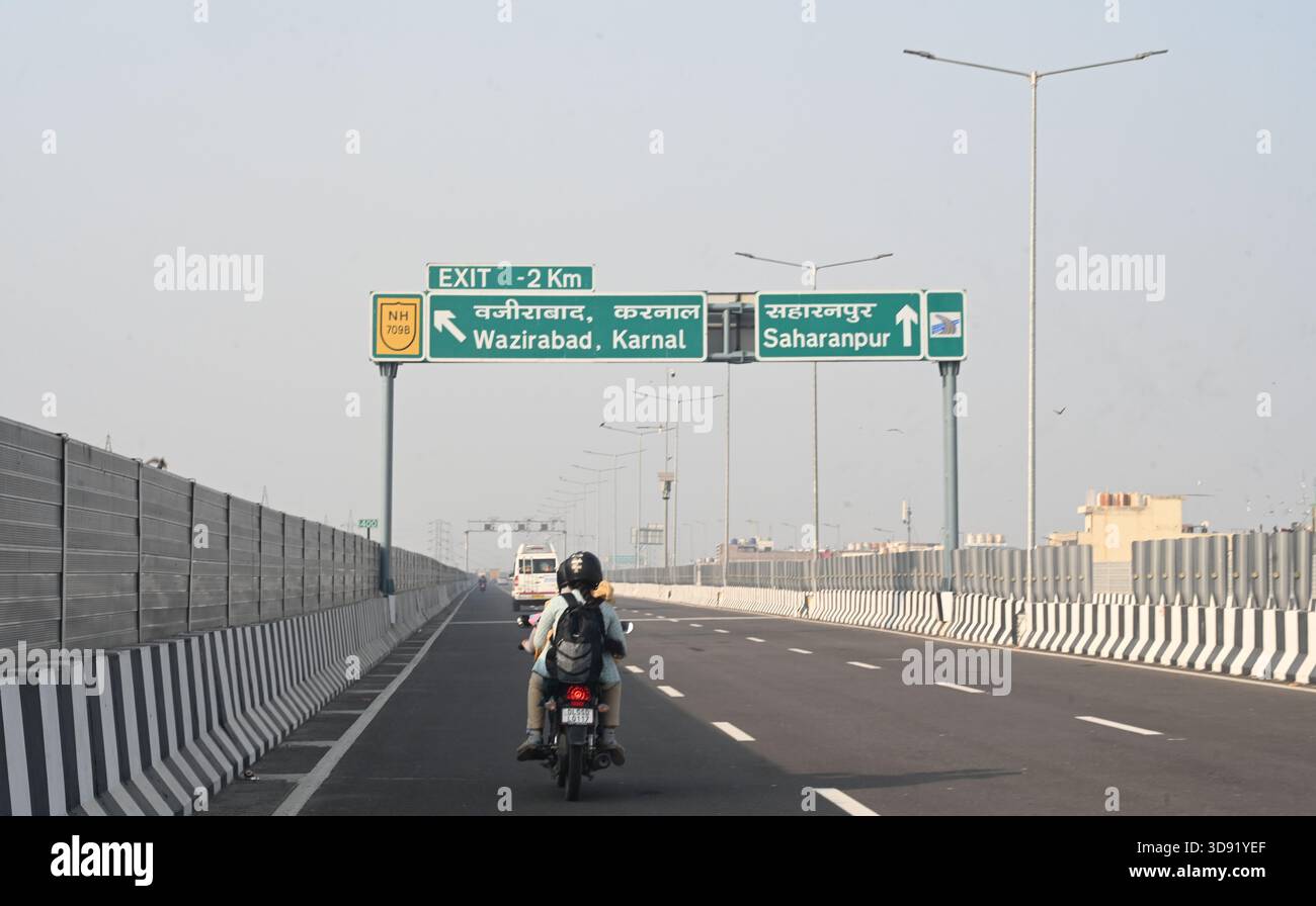 NEW DELHI, INDIA - DECEMBER 1: Traffic seen on Saharanpur Dehradun Expressway as it is open for Public Trial from last night, on December 1, 2025 in New Delhi, India. Once completed, the 210 km high-speed corridor is expected to reduce the travel time between Delhi and Dehradun from the current 6 to 6.5 hours to just 2 to 2.5 hours, significantly improving connectivity between the national capital, western Uttar Pradesh, and Uttarakhand. Authorities are preparing to inaugurate a 32 km-long completed section of the expressway between late December and early January, even as work continues at an Stock Photo