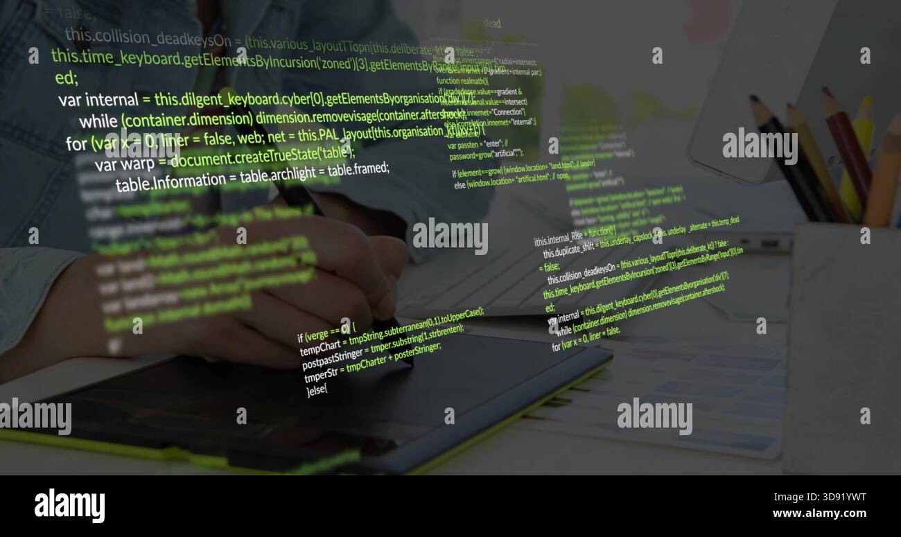 Working hands in denim shirt, using stylus editing on graphics tablet at desk, code overlay Stock Photo