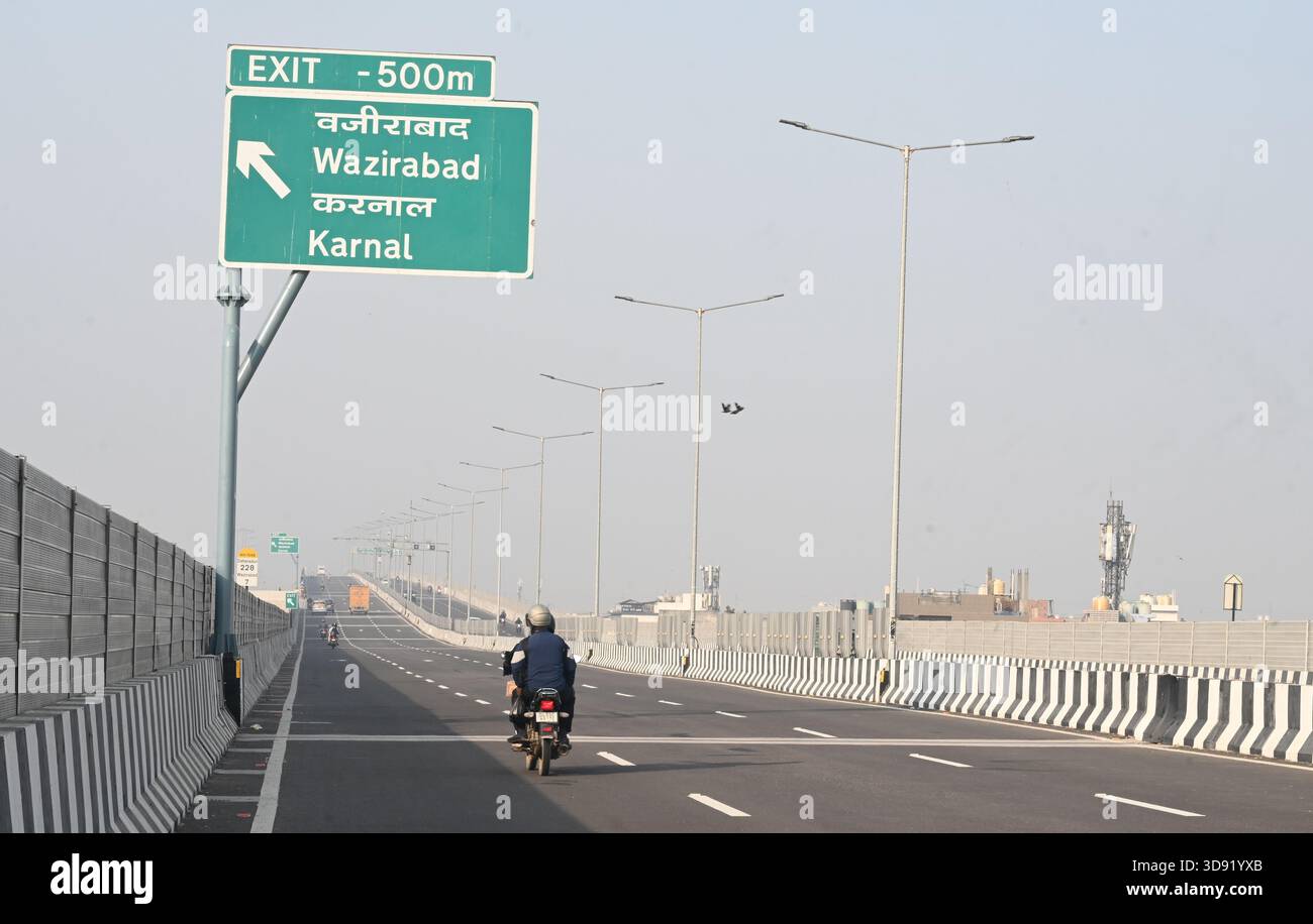 NEW DELHI, INDIA - DECEMBER 1: Traffic seen on Saharanpur Dehradun Expressway as it is open for Public Trial from last night, on December 1, 2025 in New Delhi, India. Once completed, the 210 km high-speed corridor is expected to reduce the travel time between Delhi and Dehradun from the current 6 to 6.5 hours to just 2 to 2.5 hours, significantly improving connectivity between the national capital, western Uttar Pradesh, and Uttarakhand. Authorities are preparing to inaugurate a 32 km-long completed section of the expressway between late December and early January, even as work continues at an Stock Photo