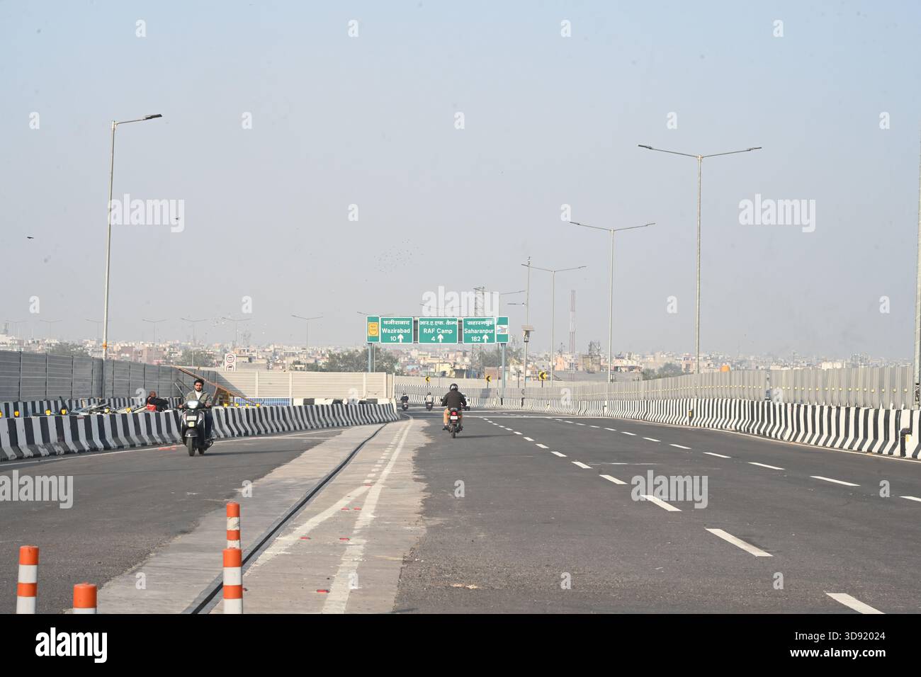 NEW DELHI, INDIA - DECEMBER 1: Traffic seen on Saharanpur Dehradun Expressway as it is open for Public Trial from last night, on December 1, 2025 in New Delhi, India. Once completed, the 210 km high-speed corridor is expected to reduce the travel time between Delhi and Dehradun from the current 6 to 6.5 hours to just 2 to 2.5 hours, significantly improving connectivity between the national capital, western Uttar Pradesh, and Uttarakhand. Authorities are preparing to inaugurate a 32 km-long completed section of the expressway between late December and early January, even as work continues at an Stock Photo