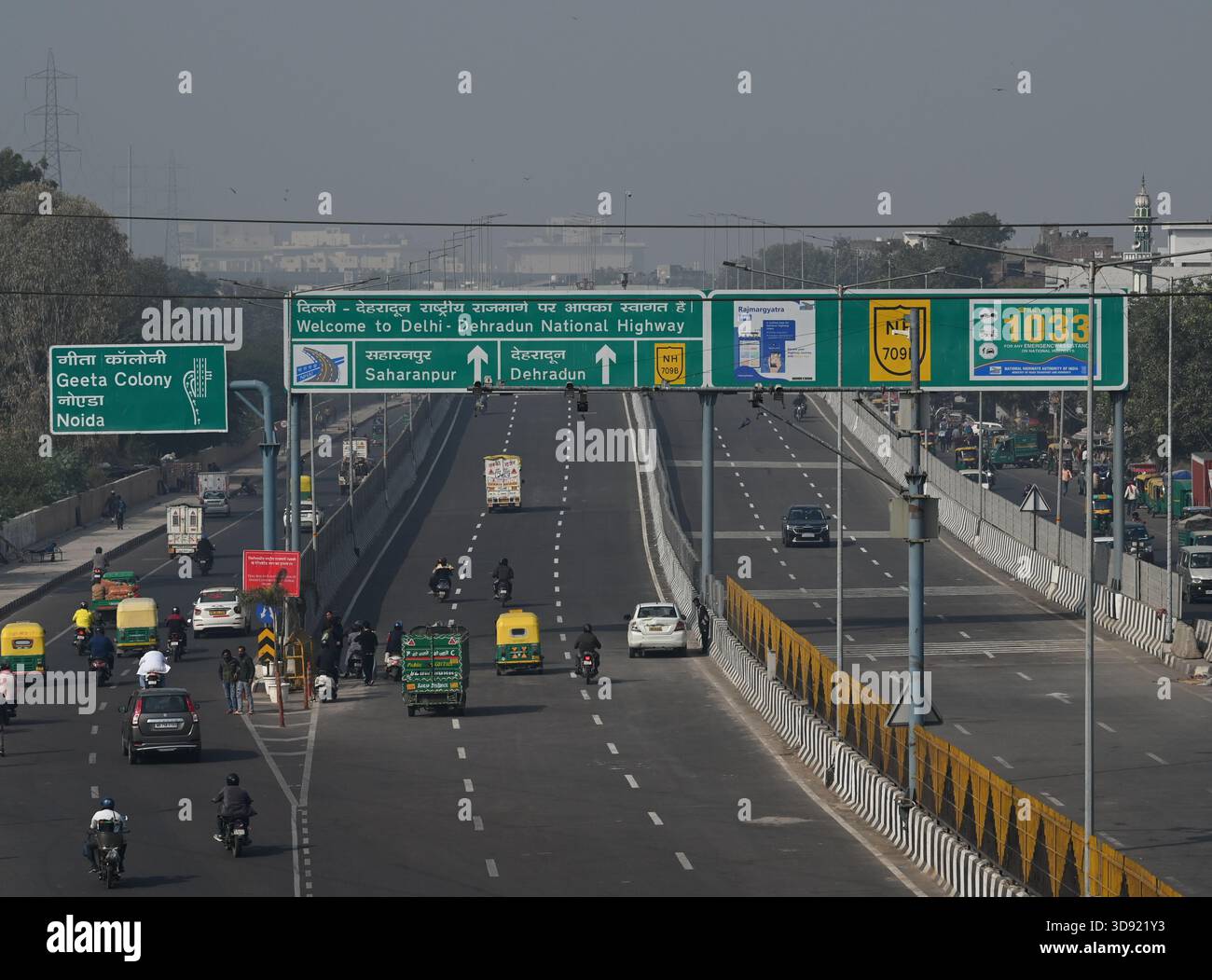 NEW DELHI, INDIA - DECEMBER 1: Traffic seen on Saharanpur Dehradun Expressway as it is open for Public Trial from last night, on December 1, 2025 in New Delhi, India. Once completed, the 210 km high-speed corridor is expected to reduce the travel time between Delhi and Dehradun from the current 6 to 6.5 hours to just 2 to 2.5 hours, significantly improving connectivity between the national capital, western Uttar Pradesh, and Uttarakhand. Authorities are preparing to inaugurate a 32 km-long completed section of the expressway between late December and early January, even as work continues at an Stock Photo