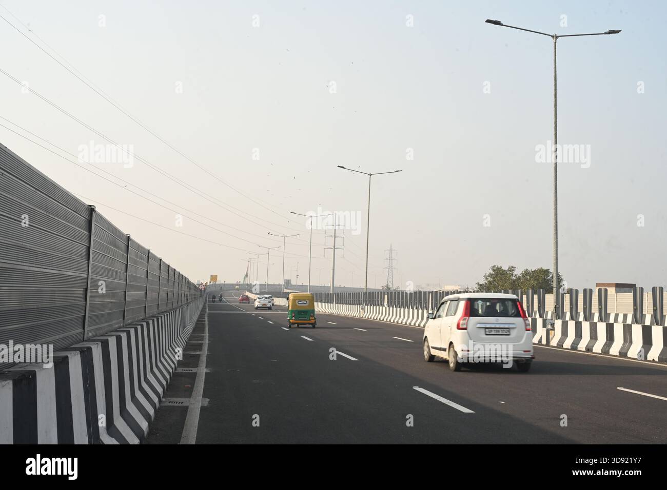 NEW DELHI, INDIA - DECEMBER 1: Traffic seen on Saharanpur Dehradun Expressway as it is open for Public Trial from last night, on December 1, 2025 in New Delhi, India. Once completed, the 210 km high-speed corridor is expected to reduce the travel time between Delhi and Dehradun from the current 6 to 6.5 hours to just 2 to 2.5 hours, significantly improving connectivity between the national capital, western Uttar Pradesh, and Uttarakhand. Authorities are preparing to inaugurate a 32 km-long completed section of the expressway between late December and early January, even as work continues at an Stock Photo