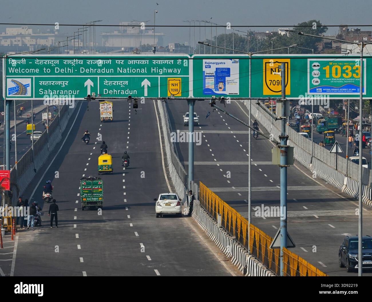 NEW DELHI, INDIA - DECEMBER 1: Traffic seen on Saharanpur Dehradun Expressway as it is open for Public Trial from last night, on December 1, 2025 in New Delhi, India. Once completed, the 210 km high-speed corridor is expected to reduce the travel time between Delhi and Dehradun from the current 6 to 6.5 hours to just 2 to 2.5 hours, significantly improving connectivity between the national capital, western Uttar Pradesh, and Uttarakhand. Authorities are preparing to inaugurate a 32 km-long completed section of the expressway between late December and early January, even as work continues at an Stock Photo
