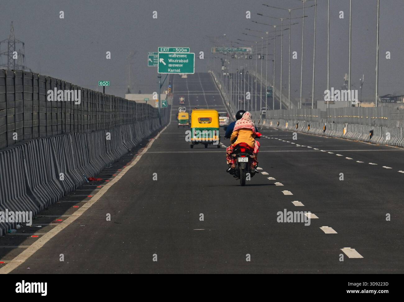 NEW DELHI, INDIA - DECEMBER 1: Traffic seen on Saharanpur Dehradun Expressway as it is open for Public Trial from last night, on December 1, 2025 in New Delhi, India. Once completed, the 210 km high-speed corridor is expected to reduce the travel time between Delhi and Dehradun from the current 6 to 6.5 hours to just 2 to 2.5 hours, significantly improving connectivity between the national capital, western Uttar Pradesh, and Uttarakhand. Authorities are preparing to inaugurate a 32 km-long completed section of the expressway between late December and early January, even as work continues at an Stock Photo