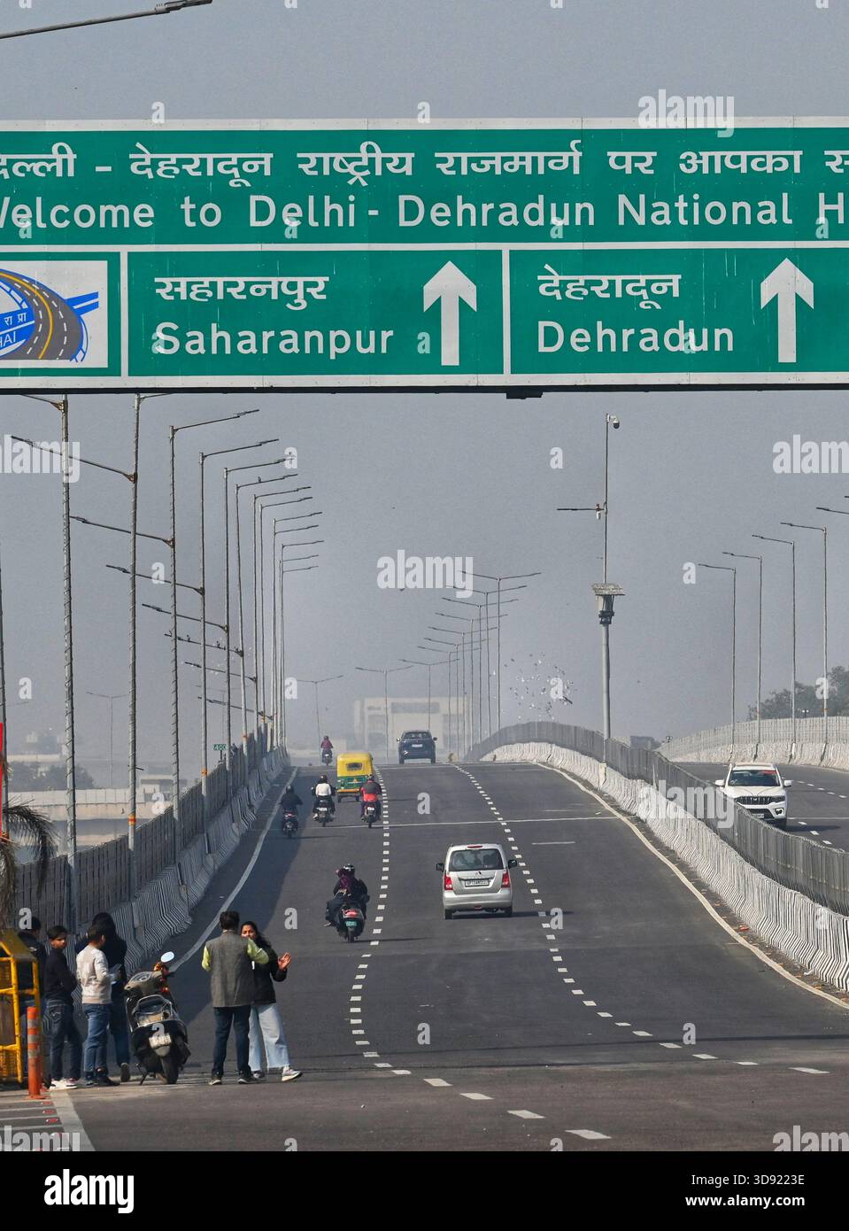 NEW DELHI, INDIA - DECEMBER 1: Traffic seen on Saharanpur Dehradun Expressway as it is open for Public Trial from last night, on December 1, 2025 in New Delhi, India. Once completed, the 210 km high-speed corridor is expected to reduce the travel time between Delhi and Dehradun from the current 6 to 6.5 hours to just 2 to 2.5 hours, significantly improving connectivity between the national capital, western Uttar Pradesh, and Uttarakhand. Authorities are preparing to inaugurate a 32 km-long completed section of the expressway between late December and early January, even as work continues at an Stock Photo