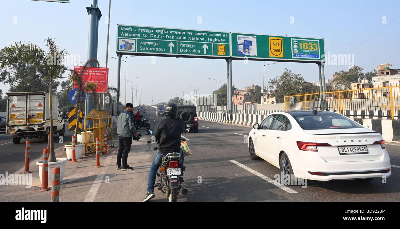 NEW DELHI, INDIA - DECEMBER 1: Traffic seen on Saharanpur Dehradun Expressway as it is open for Public Trial from last night, on December 1, 2025 in New Delhi, India. Once completed, the 210 km high-speed corridor is expected to reduce the travel time between Delhi and Dehradun from the current 6 to 6.5 hours to just 2 to 2.5 hours, significantly improving connectivity between the national capital, western Uttar Pradesh, and Uttarakhand. Authorities are preparing to inaugurate a 32 km-long completed section of the expressway between late December and early January, even as work continues at an Stock Photo