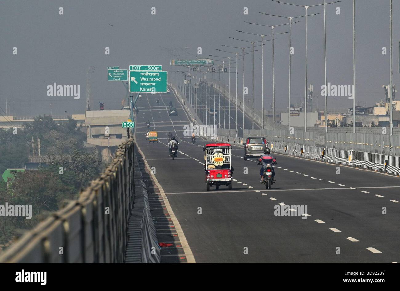 NEW DELHI, INDIA - DECEMBER 1: Traffic seen on Saharanpur Dehradun Expressway as it is open for Public Trial from last night, on December 1, 2025 in New Delhi, India. Once completed, the 210 km high-speed corridor is expected to reduce the travel time between Delhi and Dehradun from the current 6 to 6.5 hours to just 2 to 2.5 hours, significantly improving connectivity between the national capital, western Uttar Pradesh, and Uttarakhand. Authorities are preparing to inaugurate a 32 km-long completed section of the expressway between late December and early January, even as work continues at an Stock Photo