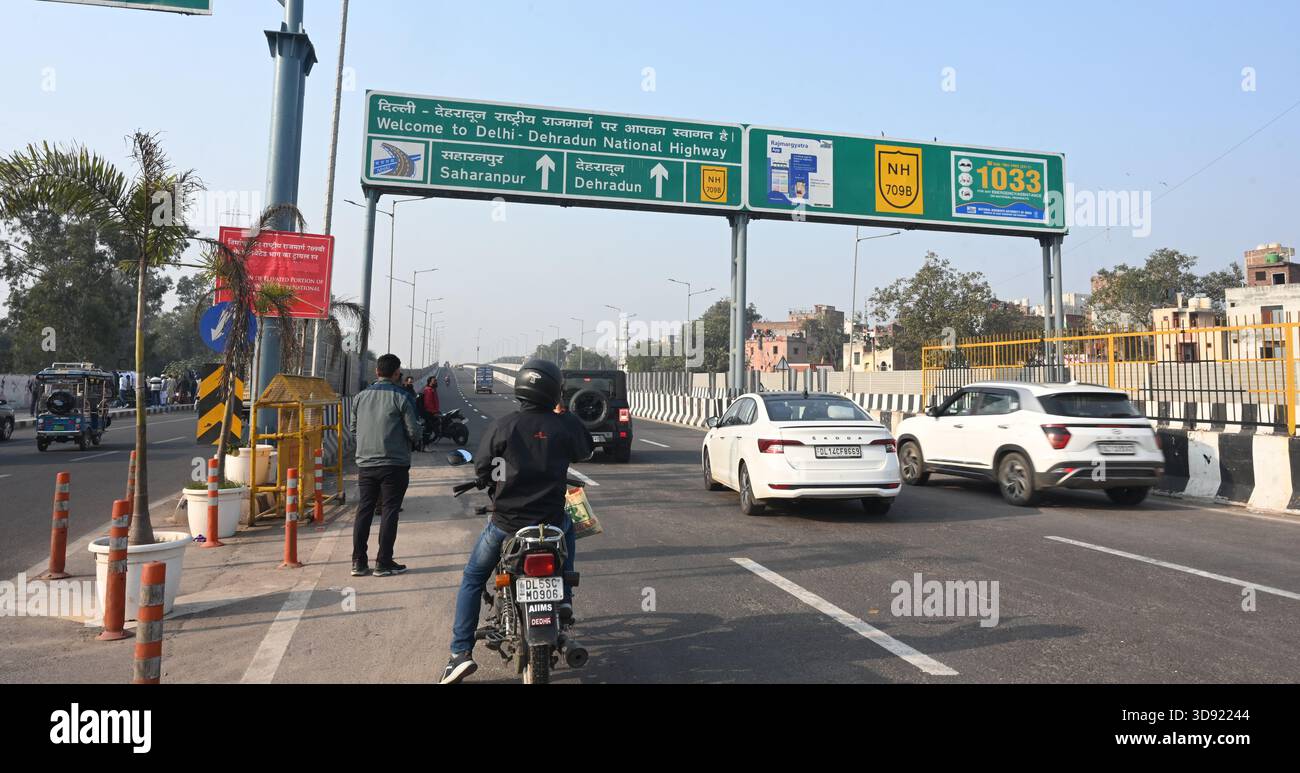NEW DELHI, INDIA - DECEMBER 1: Traffic seen on Saharanpur Dehradun Expressway as it is open for Public Trial from last night, on December 1, 2025 in New Delhi, India. Once completed, the 210 km high-speed corridor is expected to reduce the travel time between Delhi and Dehradun from the current 6 to 6.5 hours to just 2 to 2.5 hours, significantly improving connectivity between the national capital, western Uttar Pradesh, and Uttarakhand. Authorities are preparing to inaugurate a 32 km-long completed section of the expressway between late December and early January, even as work continues at an Stock Photo