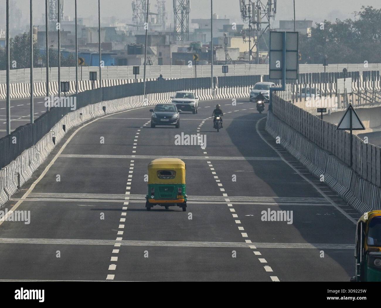 NEW DELHI, INDIA - DECEMBER 1: Traffic seen on Saharanpur Dehradun Expressway as it is open for Public Trial from last night, on December 1, 2025 in New Delhi, India. Once completed, the 210 km high-speed corridor is expected to reduce the travel time between Delhi and Dehradun from the current 6 to 6.5 hours to just 2 to 2.5 hours, significantly improving connectivity between the national capital, western Uttar Pradesh, and Uttarakhand. Authorities are preparing to inaugurate a 32 km-long completed section of the expressway between late December and early January, even as work continues at an Stock Photo