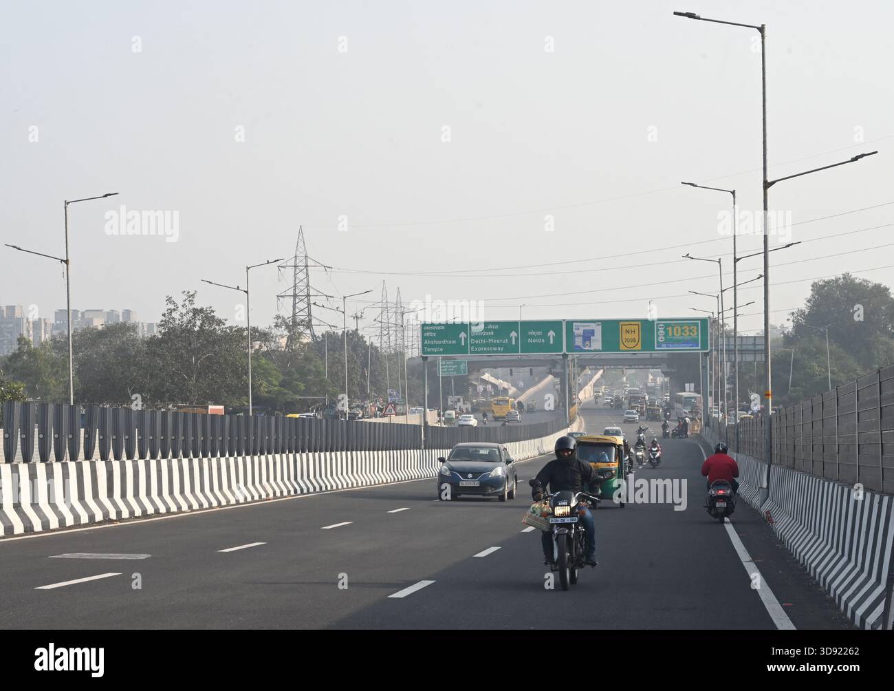 NEW DELHI, INDIA - DECEMBER 1: Traffic seen on Saharanpur Dehradun Expressway as it is open for Public Trial from last night, on December 1, 2025 in New Delhi, India. Once completed, the 210 km high-speed corridor is expected to reduce the travel time between Delhi and Dehradun from the current 6 to 6.5 hours to just 2 to 2.5 hours, significantly improving connectivity between the national capital, western Uttar Pradesh, and Uttarakhand. Authorities are preparing to inaugurate a 32 km-long completed section of the expressway between late December and early January, even as work continues at an Stock Photo