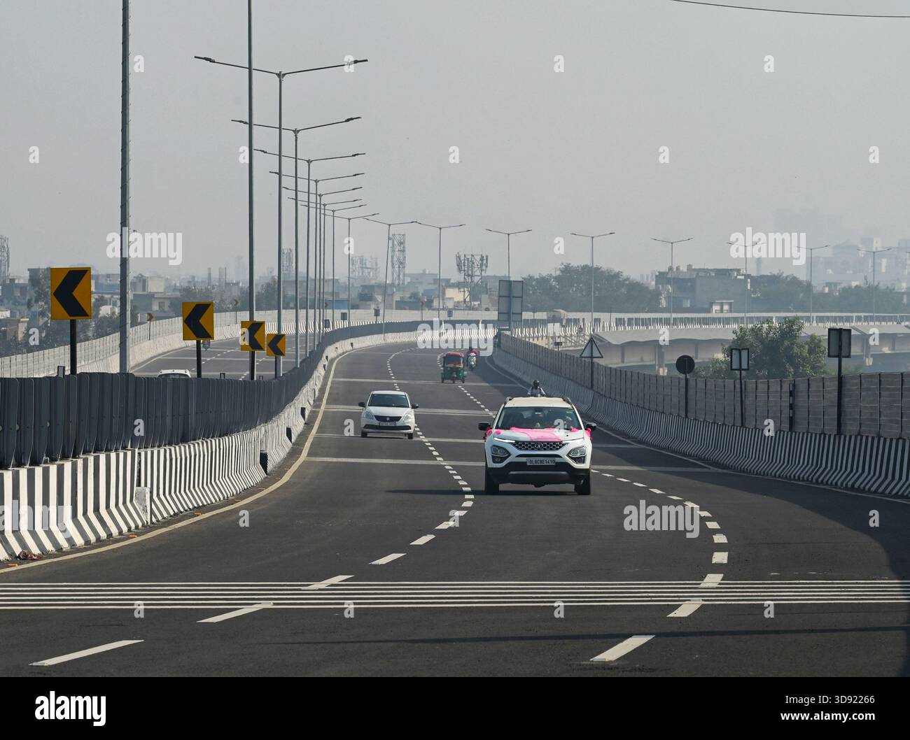 NEW DELHI, INDIA - DECEMBER 1: Traffic seen on Saharanpur Dehradun Expressway as it is open for Public Trial from last night, on December 1, 2025 in New Delhi, India. Once completed, the 210 km high-speed corridor is expected to reduce the travel time between Delhi and Dehradun from the current 6 to 6.5 hours to just 2 to 2.5 hours, significantly improving connectivity between the national capital, western Uttar Pradesh, and Uttarakhand. Authorities are preparing to inaugurate a 32 km-long completed section of the expressway between late December and early January, even as work continues at an Stock Photo