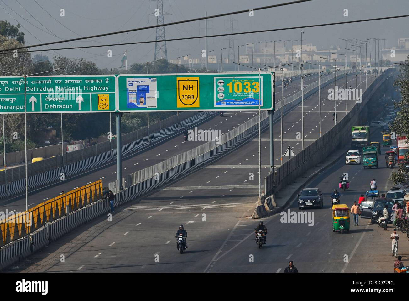 NEW DELHI, INDIA - DECEMBER 1: Traffic seen on Saharanpur Dehradun Expressway as it is open for Public Trial from last night, on December 1, 2025 in New Delhi, India. Once completed, the 210 km high-speed corridor is expected to reduce the travel time between Delhi and Dehradun from the current 6 to 6.5 hours to just 2 to 2.5 hours, significantly improving connectivity between the national capital, western Uttar Pradesh, and Uttarakhand. Authorities are preparing to inaugurate a 32 km-long completed section of the expressway between late December and early January, even as work continues at an Stock Photo