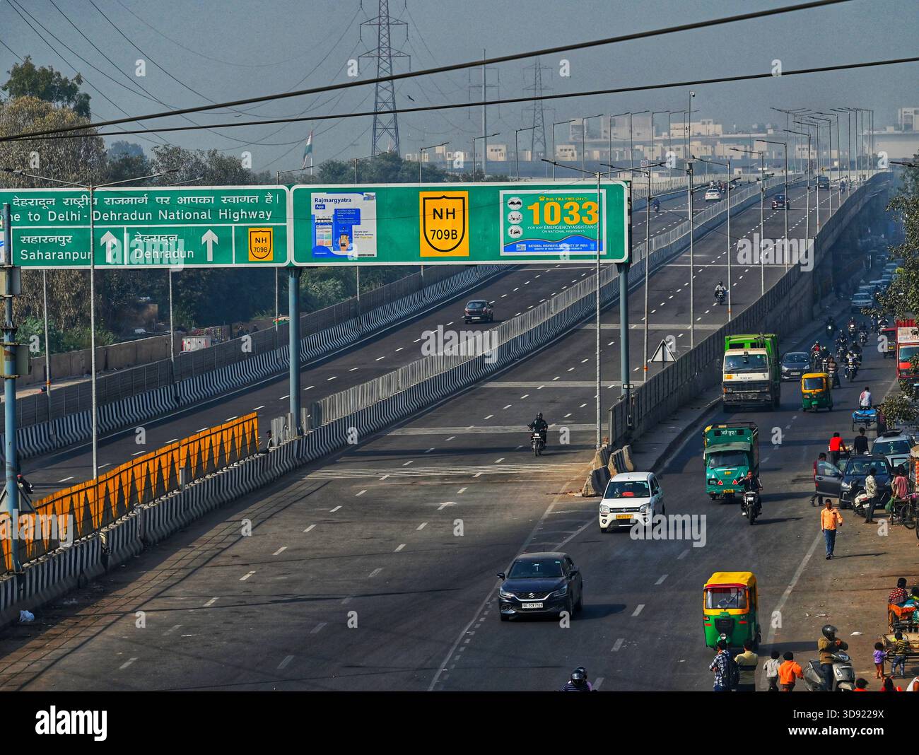 NEW DELHI, INDIA - DECEMBER 1: Traffic seen on Saharanpur Dehradun Expressway as it is open for Public Trial from last night, on December 1, 2025 in New Delhi, India. Once completed, the 210 km high-speed corridor is expected to reduce the travel time between Delhi and Dehradun from the current 6 to 6.5 hours to just 2 to 2.5 hours, significantly improving connectivity between the national capital, western Uttar Pradesh, and Uttarakhand. Authorities are preparing to inaugurate a 32 km-long completed section of the expressway between late December and early January, even as work continues at an Stock Photo