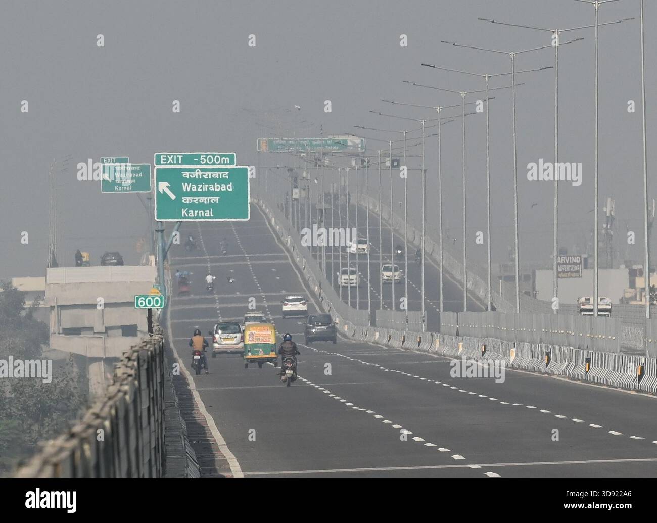 NEW DELHI, INDIA - DECEMBER 1: Traffic seen on Saharanpur Dehradun Expressway as it is open for Public Trial from last night, on December 1, 2025 in New Delhi, India. Once completed, the 210 km high-speed corridor is expected to reduce the travel time between Delhi and Dehradun from the current 6 to 6.5 hours to just 2 to 2.5 hours, significantly improving connectivity between the national capital, western Uttar Pradesh, and Uttarakhand. Authorities are preparing to inaugurate a 32 km-long completed section of the expressway between late December and early January, even as work continues at an Stock Photo