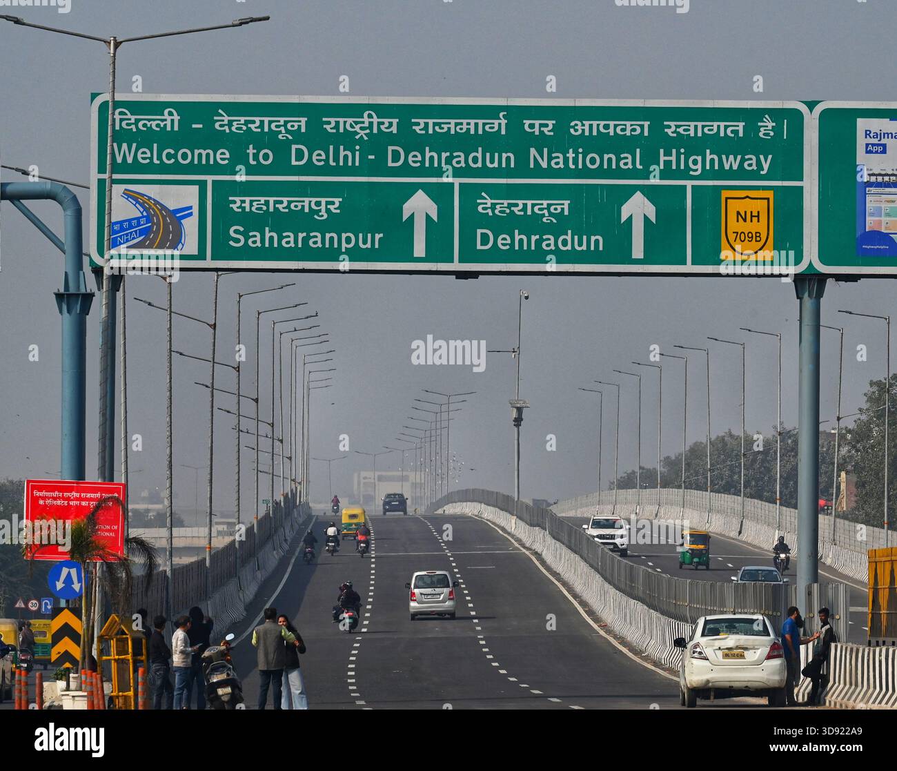 NEW DELHI, INDIA - DECEMBER 1: Traffic seen on Saharanpur Dehradun Expressway as it is open for Public Trial from last night, on December 1, 2025 in New Delhi, India. Once completed, the 210 km high-speed corridor is expected to reduce the travel time between Delhi and Dehradun from the current 6 to 6.5 hours to just 2 to 2.5 hours, significantly improving connectivity between the national capital, western Uttar Pradesh, and Uttarakhand. Authorities are preparing to inaugurate a 32 km-long completed section of the expressway between late December and early January, even as work continues at an Stock Photo