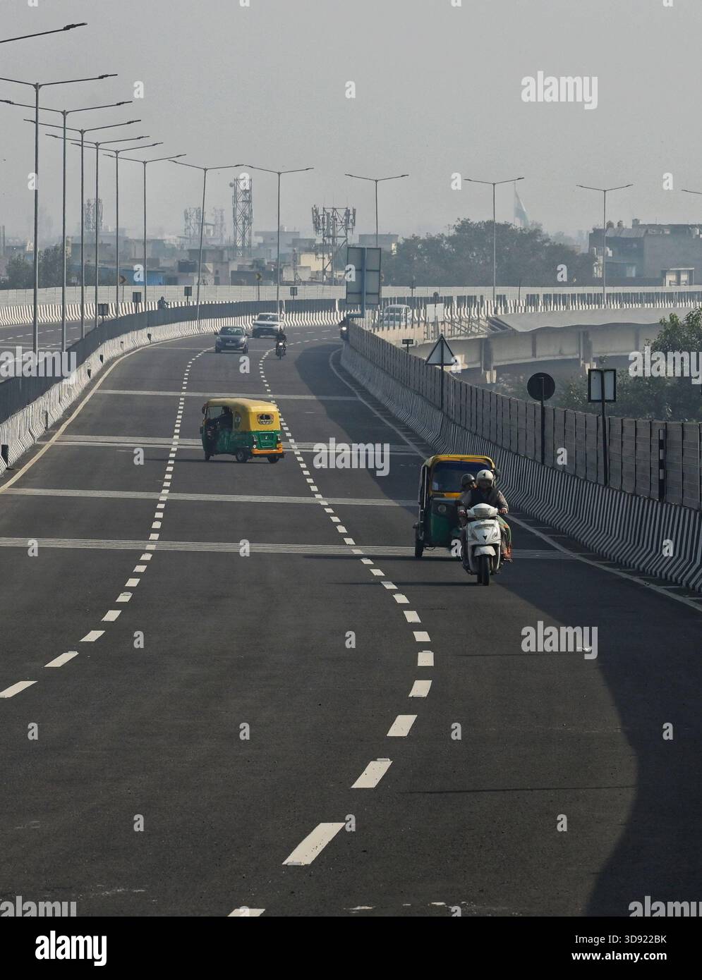 NEW DELHI, INDIA - DECEMBER 1: Traffic seen on Saharanpur Dehradun Expressway as it is open for Public Trial from last night, on December 1, 2025 in New Delhi, India. Once completed, the 210 km high-speed corridor is expected to reduce the travel time between Delhi and Dehradun from the current 6 to 6.5 hours to just 2 to 2.5 hours, significantly improving connectivity between the national capital, western Uttar Pradesh, and Uttarakhand. Authorities are preparing to inaugurate a 32 km-long completed section of the expressway between late December and early January, even as work continues at an Stock Photo