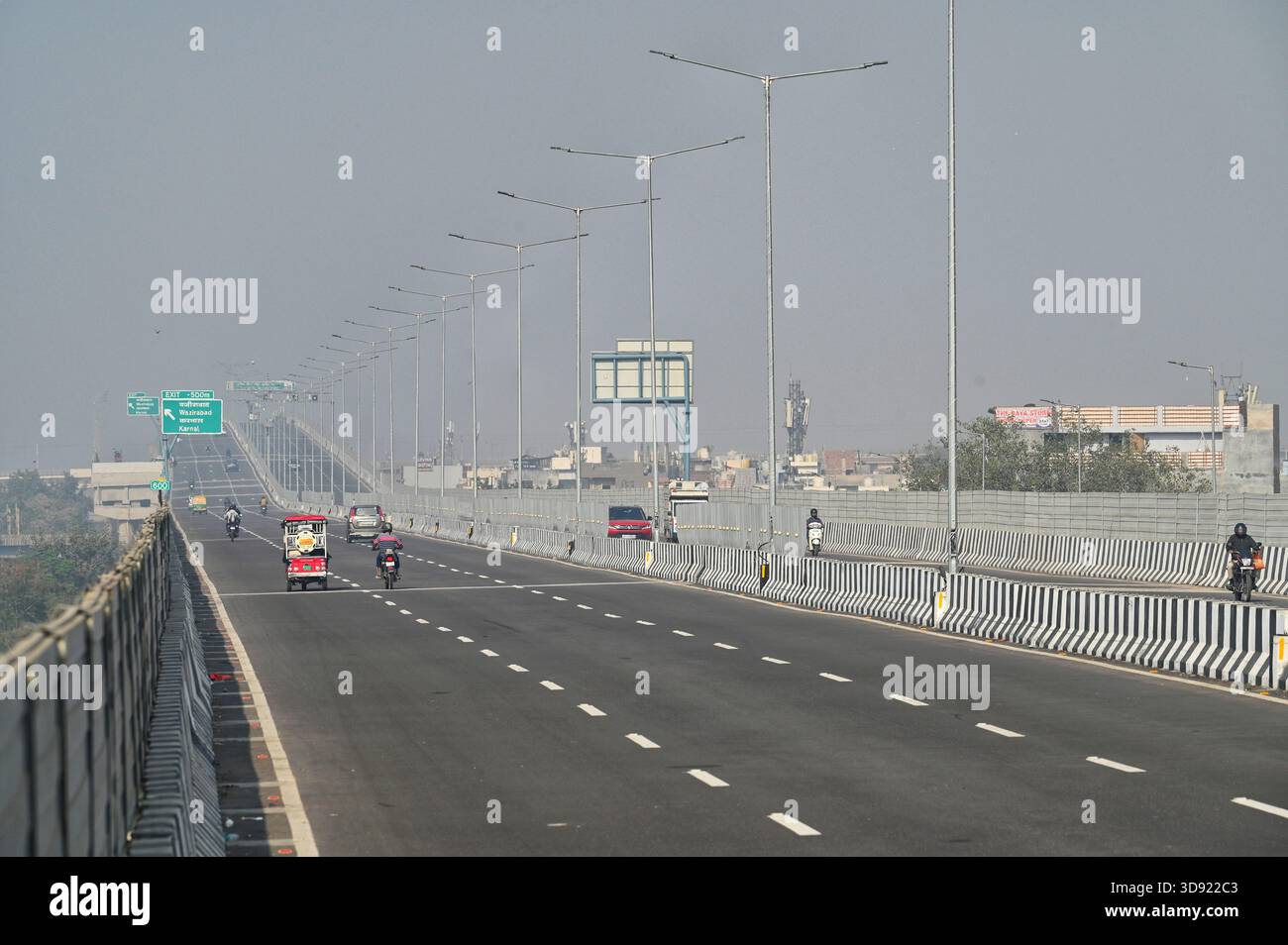 NEW DELHI, INDIA - DECEMBER 1: Traffic seen on Saharanpur Dehradun Expressway as it is open for Public Trial from last night, on December 1, 2025 in New Delhi, India. Once completed, the 210 km high-speed corridor is expected to reduce the travel time between Delhi and Dehradun from the current 6 to 6.5 hours to just 2 to 2.5 hours, significantly improving connectivity between the national capital, western Uttar Pradesh, and Uttarakhand. Authorities are preparing to inaugurate a 32 km-long completed section of the expressway between late December and early January, even as work continues at an Stock Photo