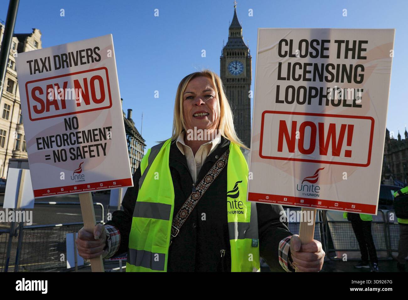 London, UK, 3rd November 2025. A Unite Union member holds placards during a demonstration.Taxi and private hire drivers protested in Westminster, calling for action on the Casey report's call to end out-of-area licensing. The demonstration, organised by the Unite union, brought together drivers from across the UK who are concerned about regulations, safety, and driver incomes. The key issue is licence shopping—current laws allow drivers to get licensed by any local authority, no matter where they intend to work. Credit:James Willoughby/ALAMY Live News Stock Photo