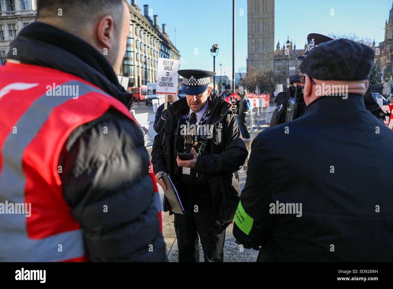 London, UK, 3rd November 2025. Police officers confront Unite Union members during a demonstration. Taxi and private hire drivers protested in Westminster, calling for action on the Casey report's call to end out-of-area licensing. The demonstration, organised by the Unite union, brought together drivers from across the UK who are concerned about regulations, safety, and driver incomes. The key issue is licence shopping—current laws allow drivers to get licensed by any local authority, no matter where they intend to work. Credit:James Willoughby/ALAMY Live News Stock Photo