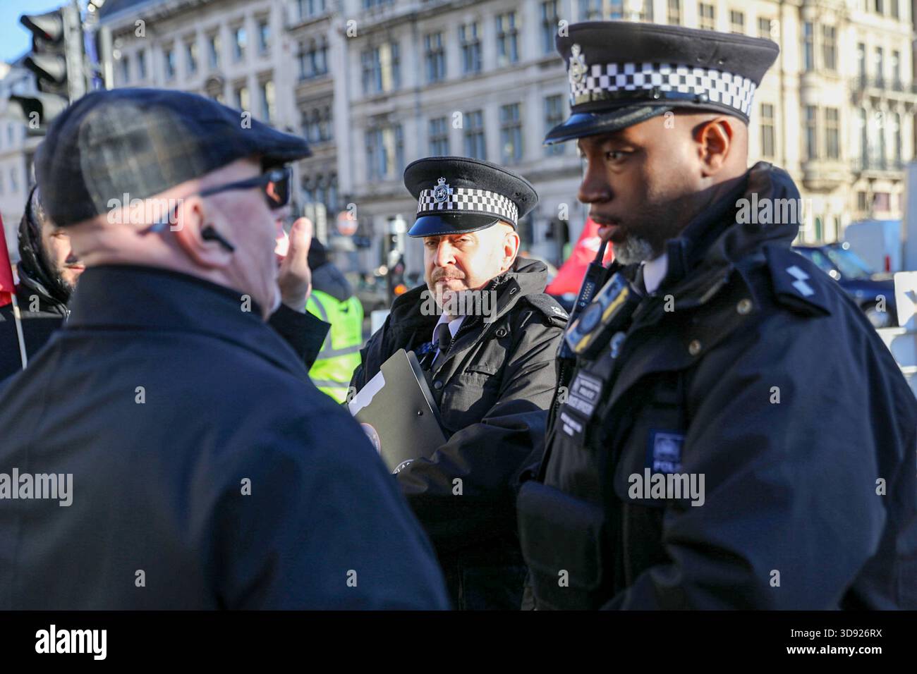 London, UK, 3rd November 2025. Police officers confront a Unite Union member during a demonstration. Taxi and private hire drivers protested in Westminster, calling for action on the Casey report's call to end out-of-area licensing. The demonstration, organised by the Unite union, brought together drivers from across the UK who are concerned about regulations, safety, and driver incomes. The key issue is licence shopping—current laws allow drivers to get licensed by any local authority, no matter where they intend to work. Credit:James Willoughby/ALAMY Live News Stock Photo