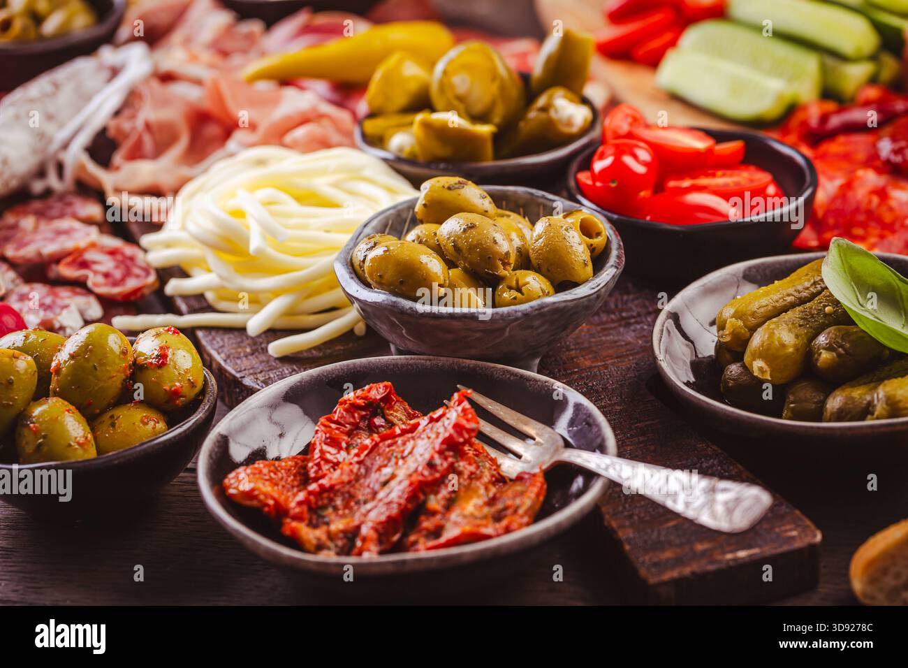 Appertiter platter with assorted meat and cheese, snacks and vegetables Stock Photo