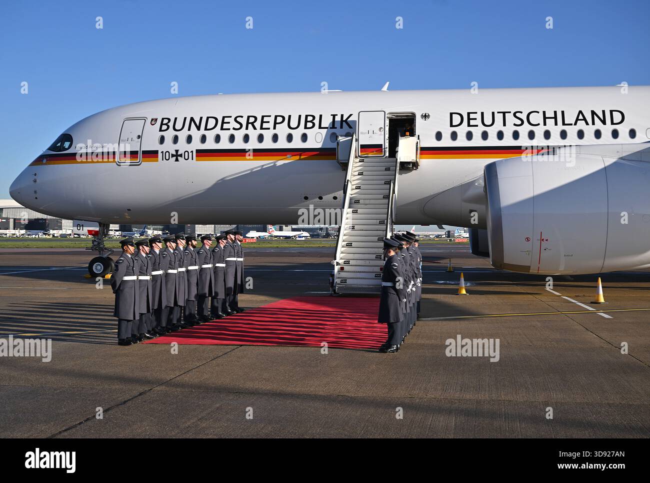 The Carpet Lining Party, formed by the King's Colour Squadron of the Royal Air Force, stand by the plane carrying German President Frank-Walter Steinmeier and his wife Elke Budenbender, as they prepare for disembarkation at London Heathrow Airport, on day one of the state visit to the UK by the President of the Federal Republic of Germany. Picture date: Wednesday December 3, 2025. Stock Photo