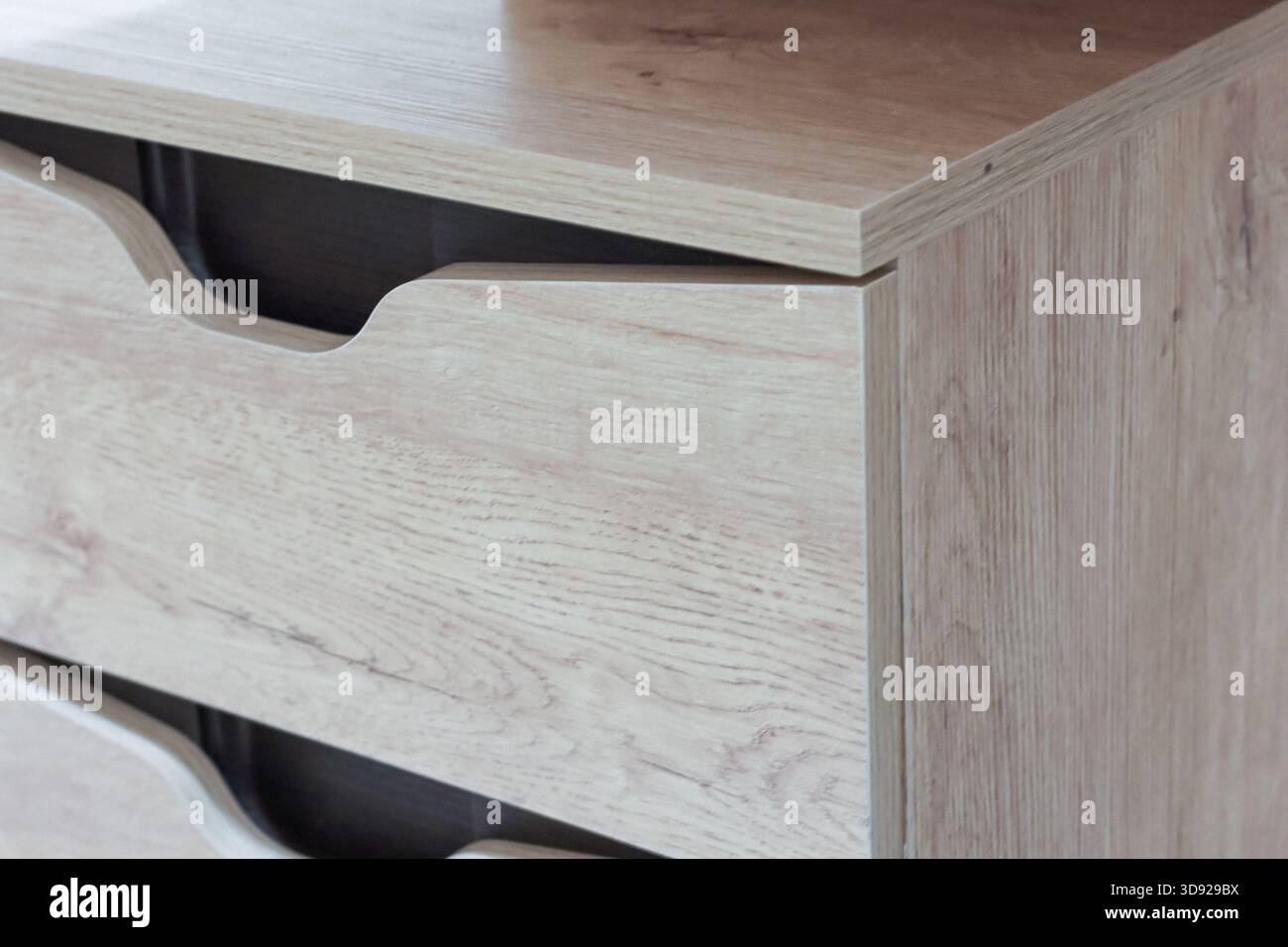 View of wooden furniture drawers in light oak finish with built-in ...