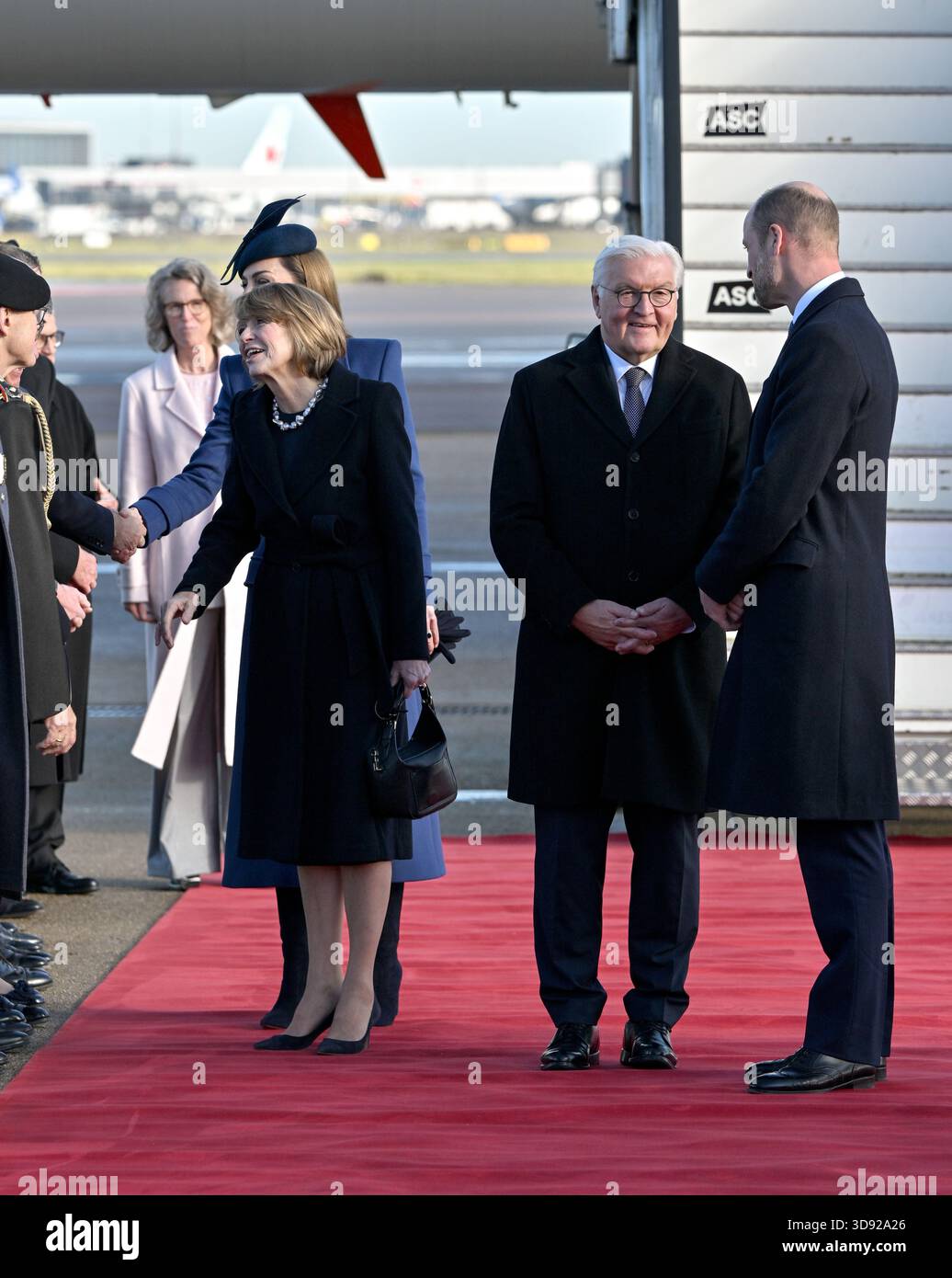 The Princess of Wales meets members of the carpet lining party with Elke Budenbender, as the Prince of Wales speaks to German President Frank-Walter Steinmeier as they arrive at London Heathrow Airport, on day one of the state visit to the UK by the President of the Federal Republic of Germany. Picture date: Wednesday December 3, 2025. Stock Photo