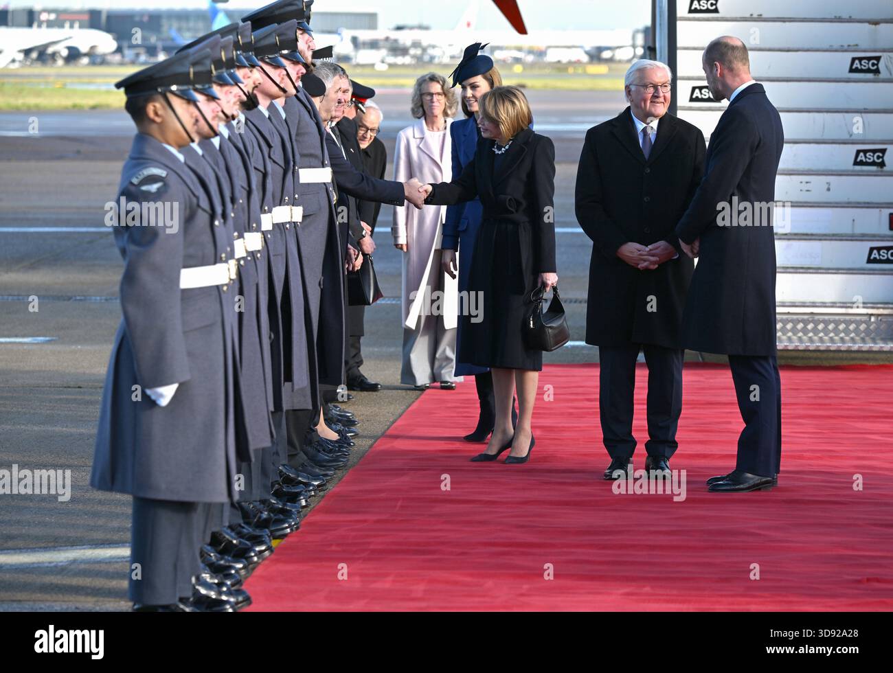 The Princess of Wales meets members of the carpet lining party with Elke Budenbender, as the Prince of Wales speaks to German President Frank-Walter Steinmeier as they arrive at London Heathrow Airport, on day one of the state visit to the UK by the President of the Federal Republic of Germany. Picture date: Wednesday December 3, 2025. Stock Photo