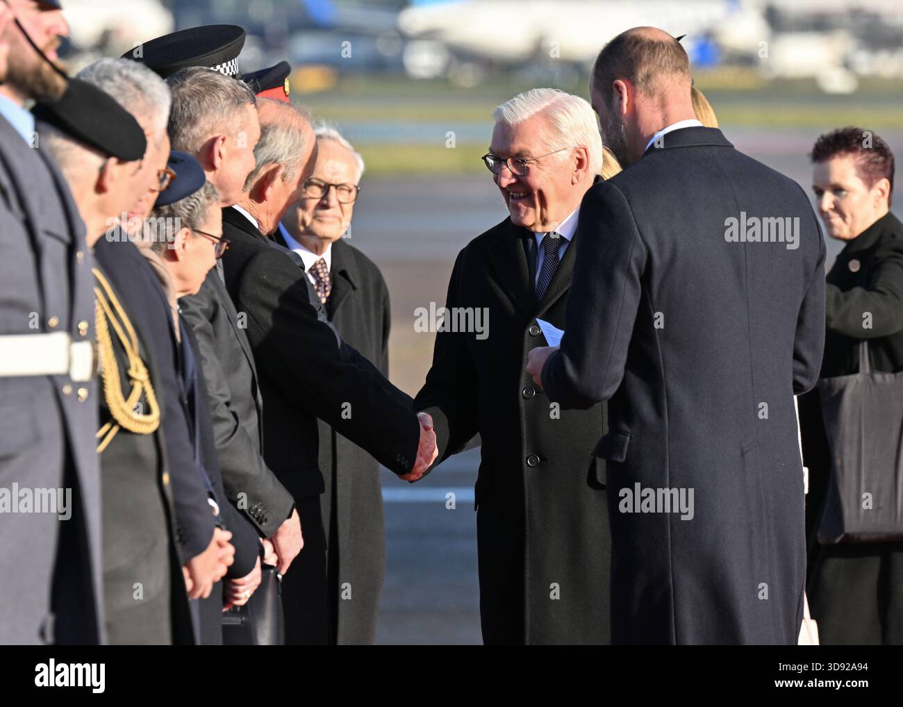 The Prince of Wales and German President Frank-Walter Steinmeier (centre)meet members of the carpet lining party as he arrives at London Heathrow Airport, on day one of the state visit to the UK by the President of the Federal Republic of Germany. Picture date: Wednesday December 3, 2025. Stock Photo