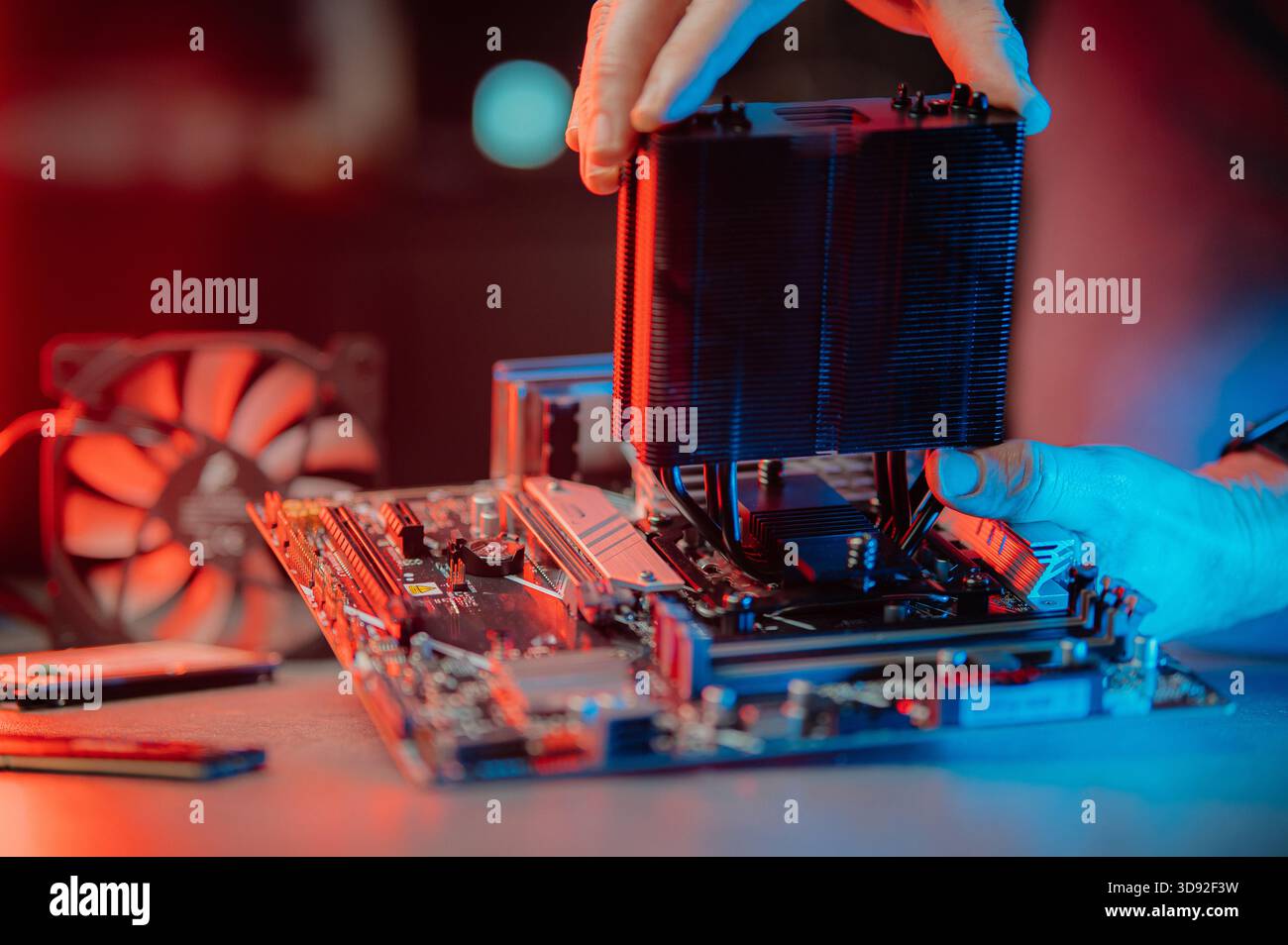 Man assembles a computer system unit at home Stock Photo