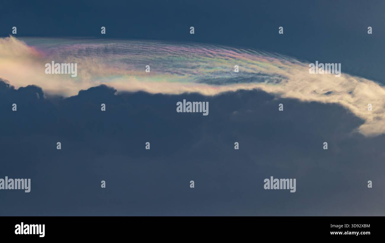Iridescent cloud formations late afternoon Stock Photo