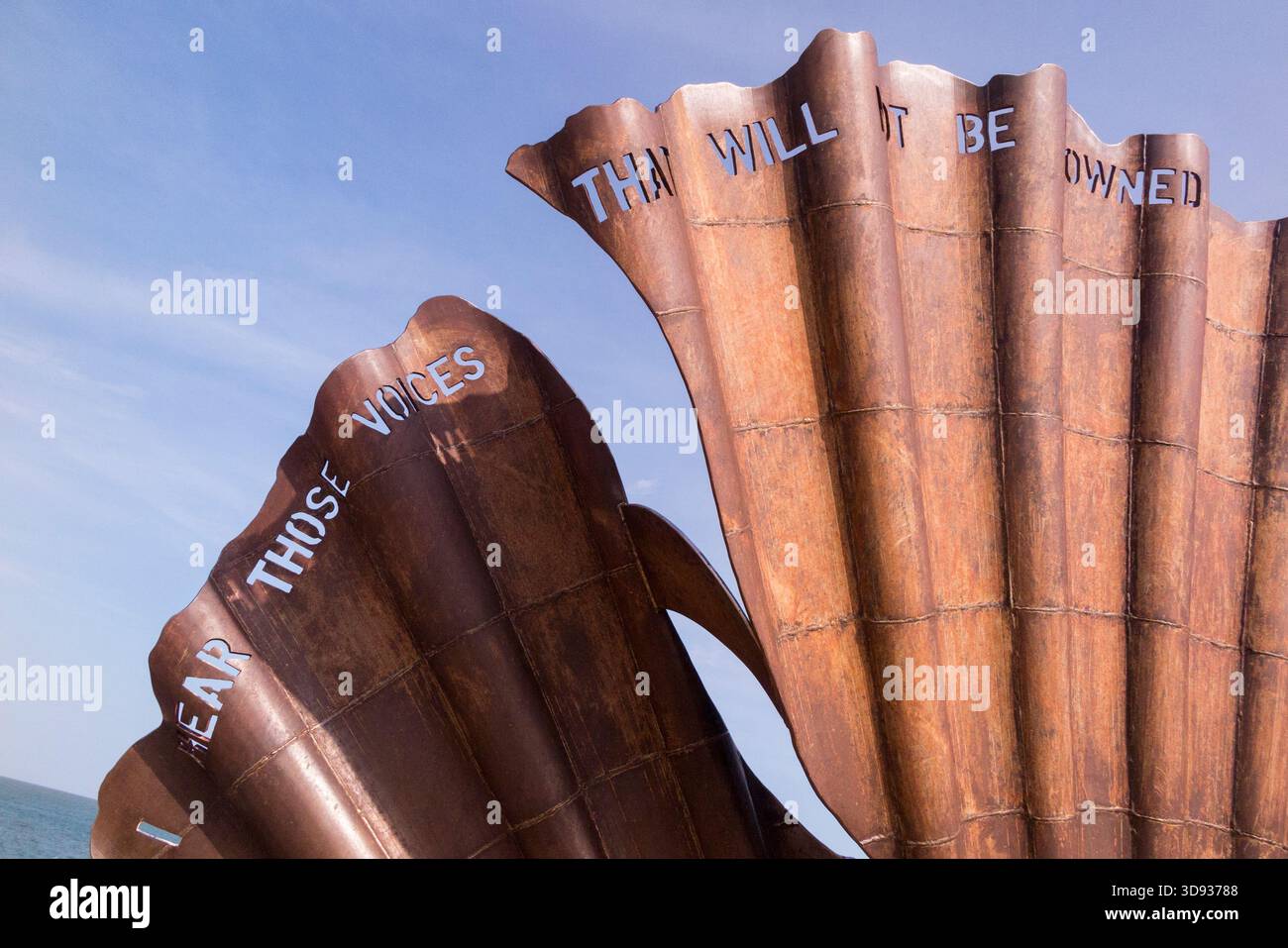 Sculpture 'Scallop' is a 2003 work by British artist Maggi Hambling. It is located on Aldeburgh beach, Suffolk, UK, in an Area of Outstanding Natural Beauty. Quotation words are taken from Peter Grimes by Sir Benjamin Brittain. (140) Stock Photo
