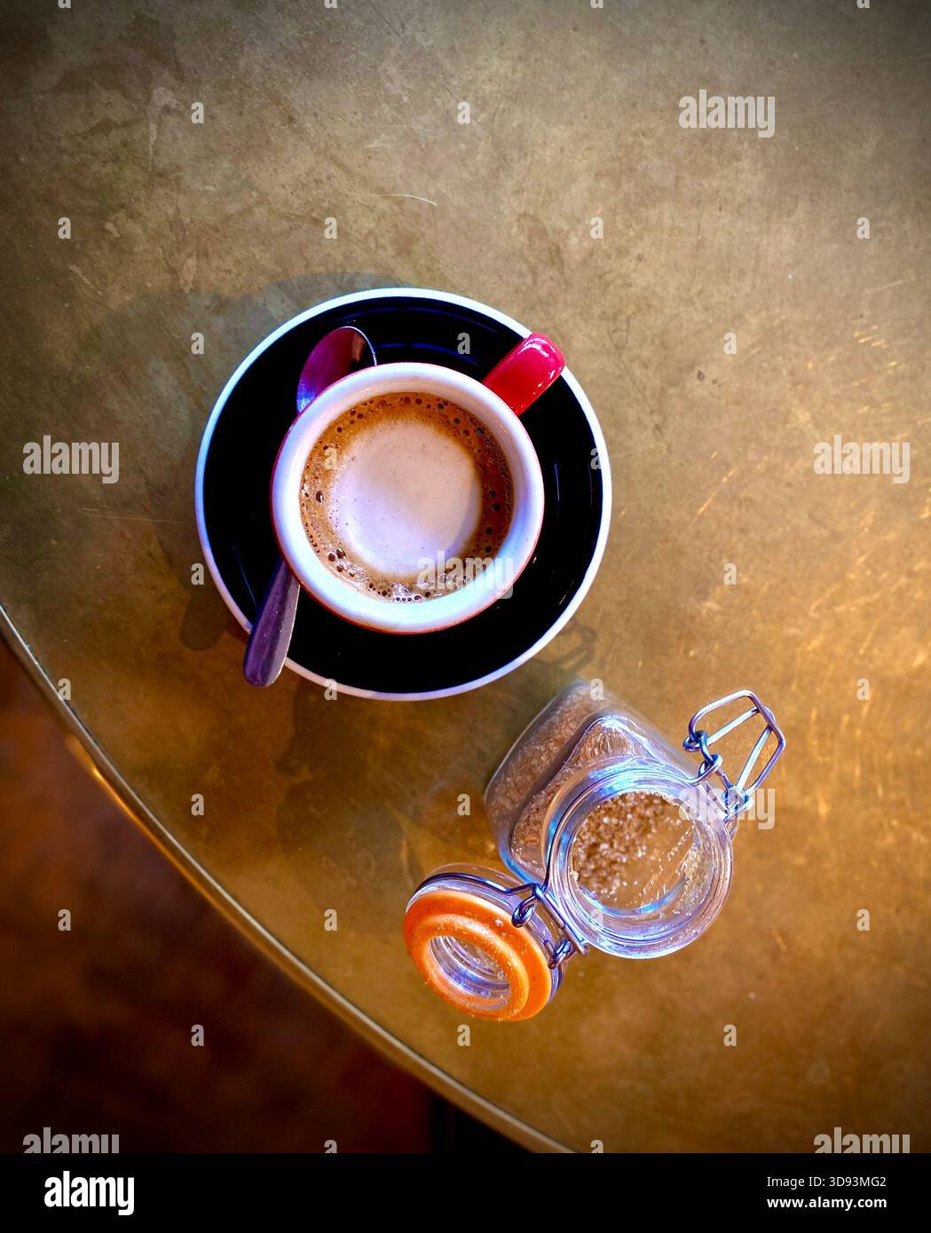 A Macchiato Coffee and sugar pot from above on a copper table,  West Suusex - Smartphone Captured Stock Image