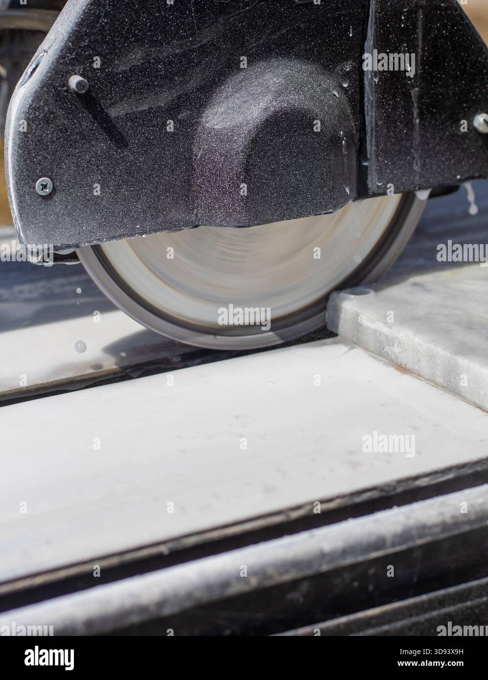 Cutting stone tiles with a tile cutter. Selective focus. work. Stock Photo