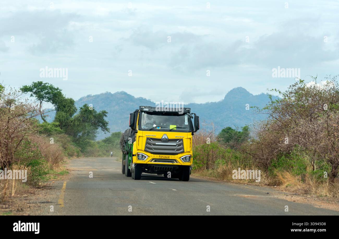 Southern Malawi, Africa. 15.11.2025.  Covered lorry on a rural road with background of the Nkope Hills in southern Malawi Africa. - Stock Image