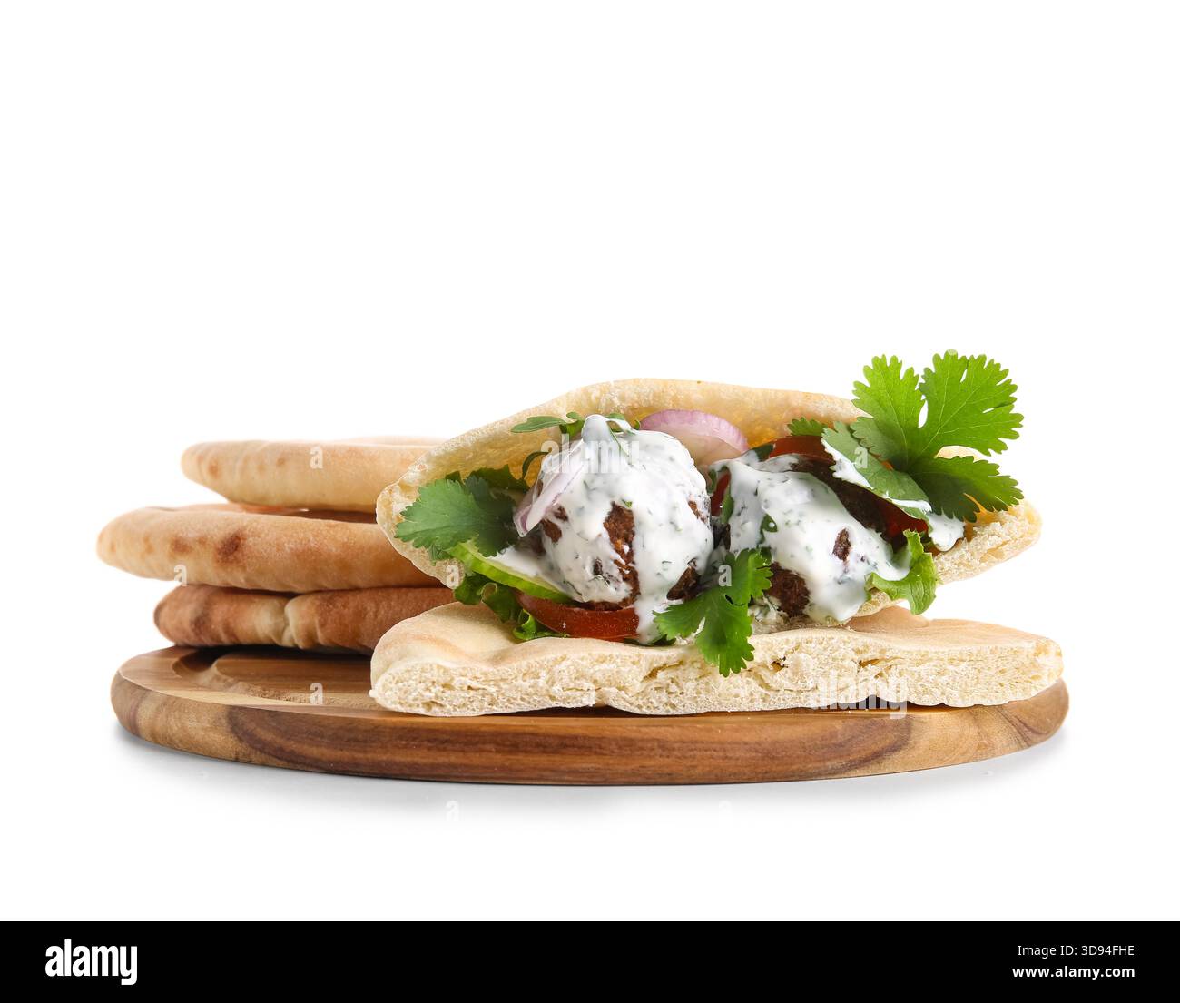 Wooden board of delicious pitas with falafel on white background Stock Photo