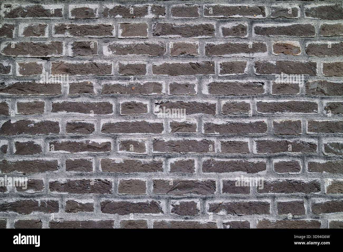 Full frame close-up on a black  brick wall. Stock Photo