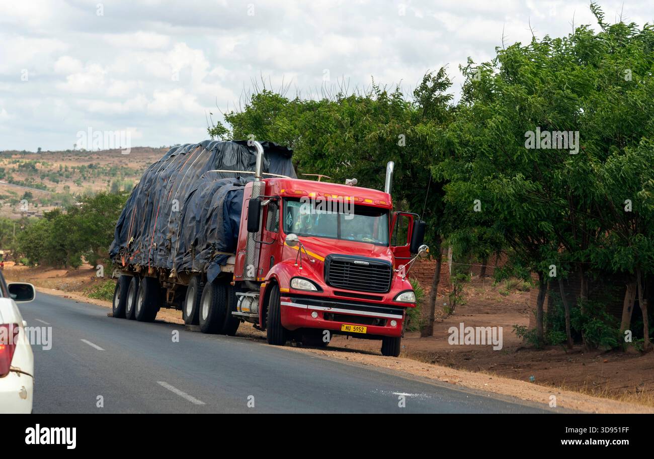 Malawi Africa. 13.11.2025.  Broken down truck on roadside with blocks by the wheels to prevent the truck moving backwards, - Stock Image