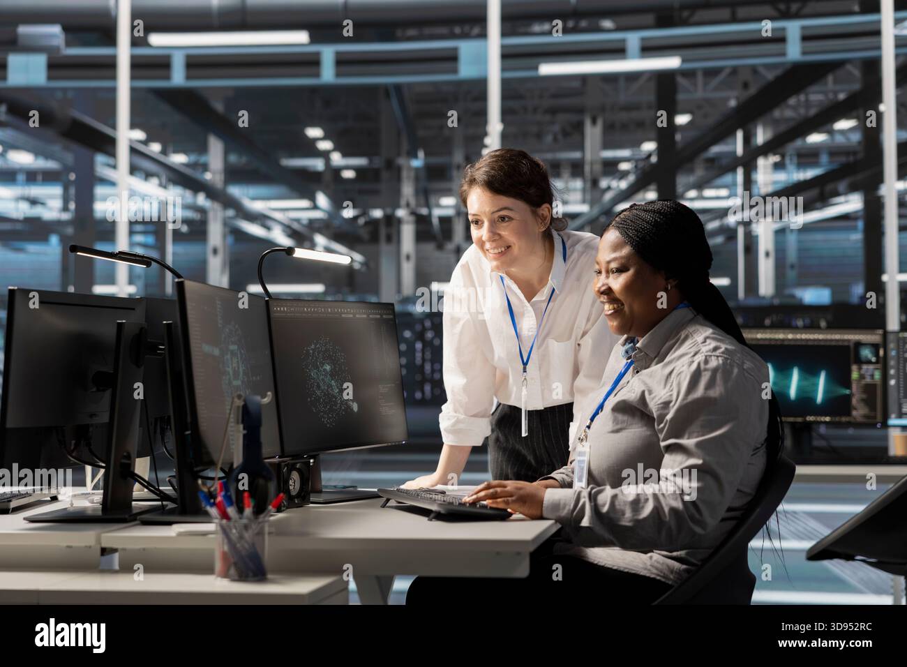 Data center admins monitoring hi-res stock photography and images - Alamy