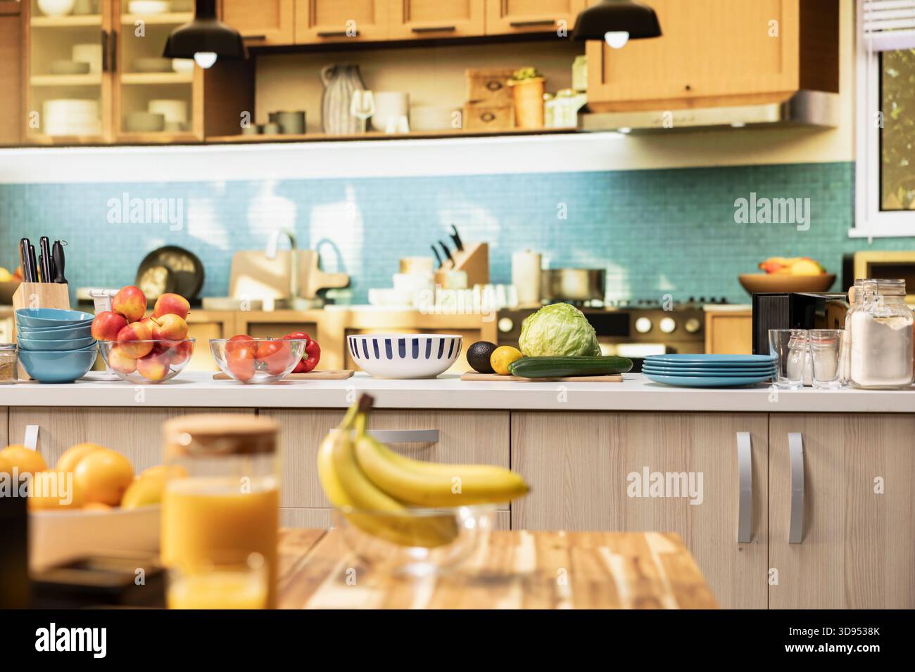 Empty kitchen with wooden dining furniture and modern appliances. Countertop displays colorful vegetables, fresh fruits and spices, representing a stylish home with cozy atmosphere. Stock Photo
