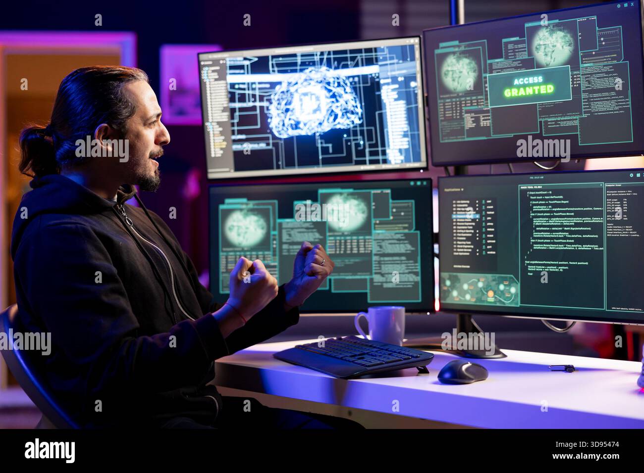 Cheerful rogue programmer delighted after getting access granted message after using undetectable malware. Hacker doing victory hand gesture after breaching firewall security using data mining script Stock Photo