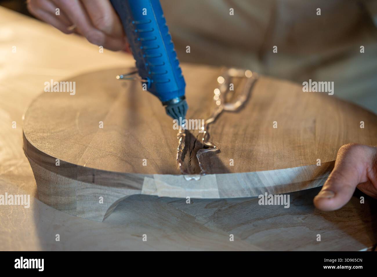 Carpenter repairs wooden stool hi-res stock photography and images - Alamy