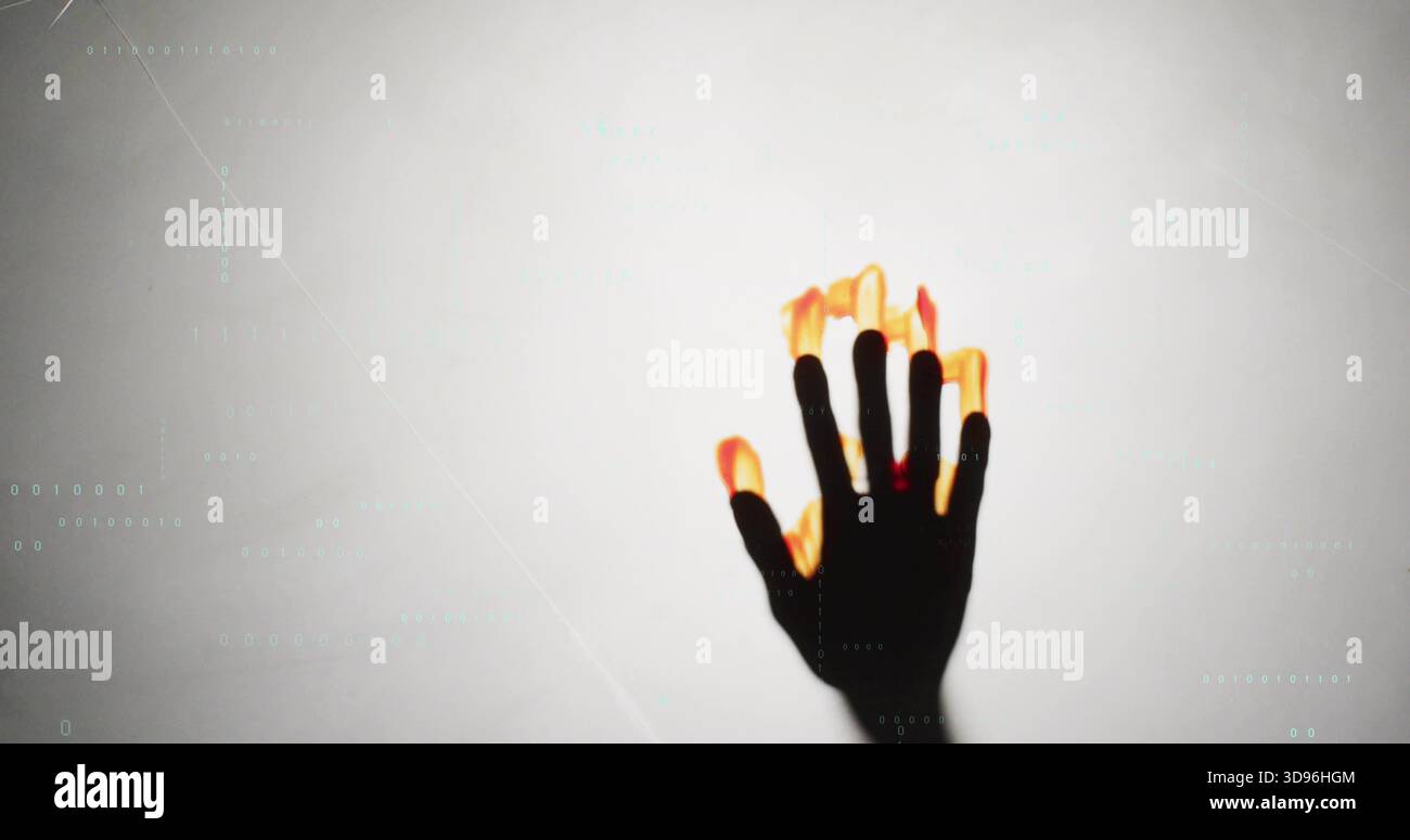 Reaching dark hand showing glowing flame fingertips at studio backdrop, cyan code lines, copy space Stock Photo