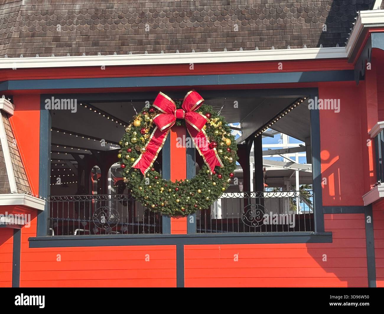 Christmas Wreath on Red Building at Santa Cruz Boardwalk - Smartphone Captured Stock Image