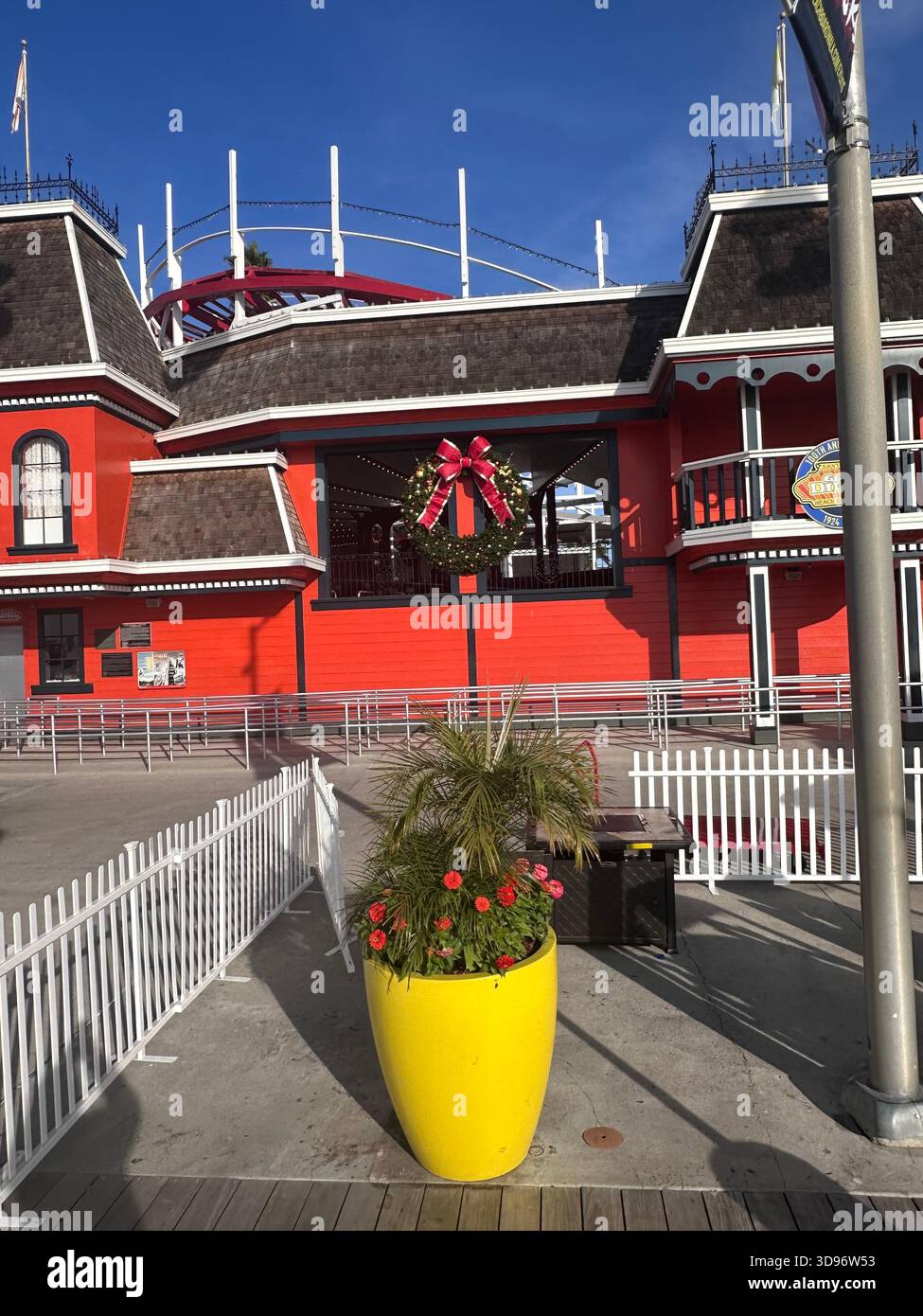 Christmas Wreath on Red Building at Santa Cruz Boardwalk - Smartphone Captured Stock Image