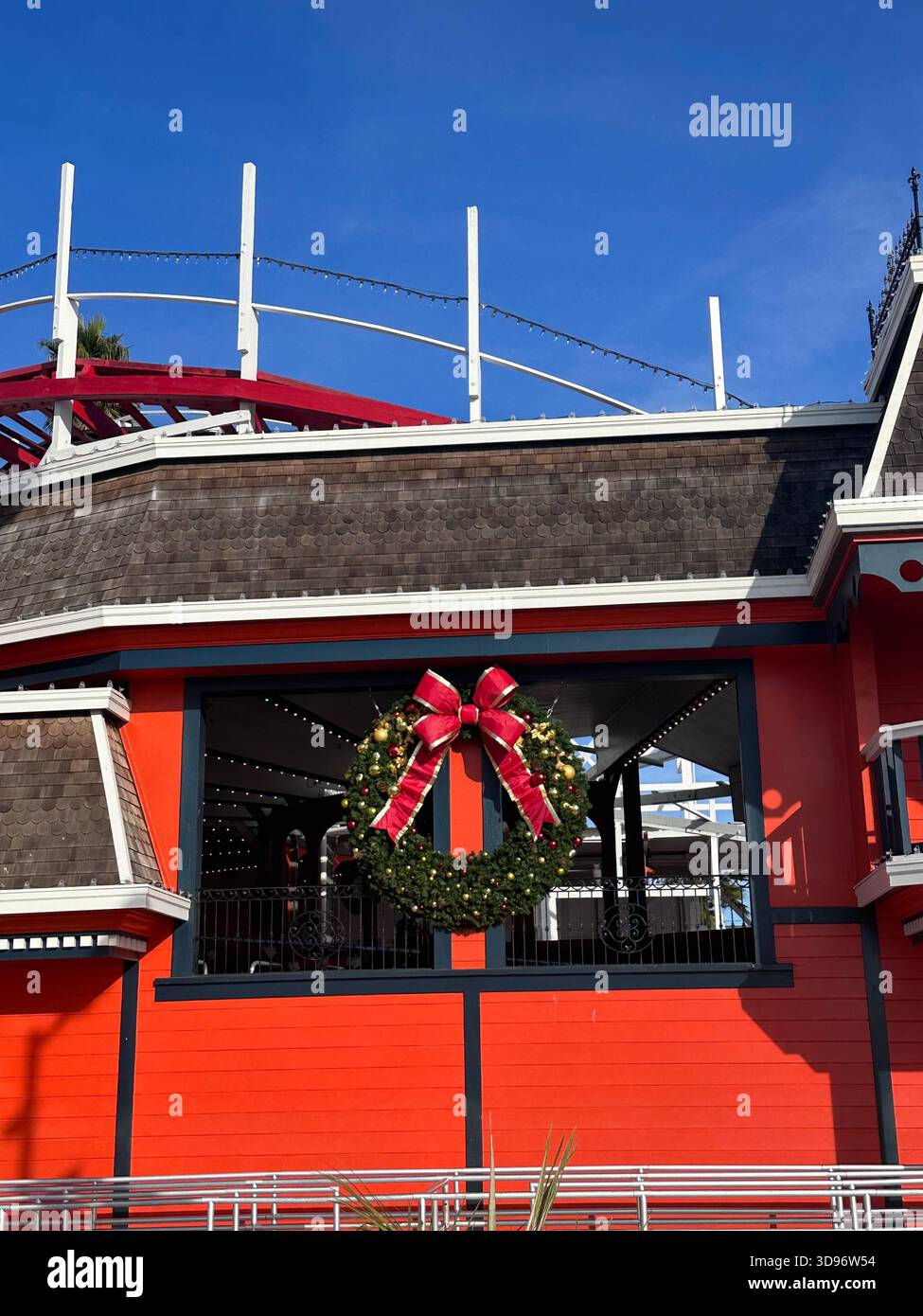 Christmas Wreath on Red Building at Santa Cruz Boardwalk - Smartphone Captured Stock Image