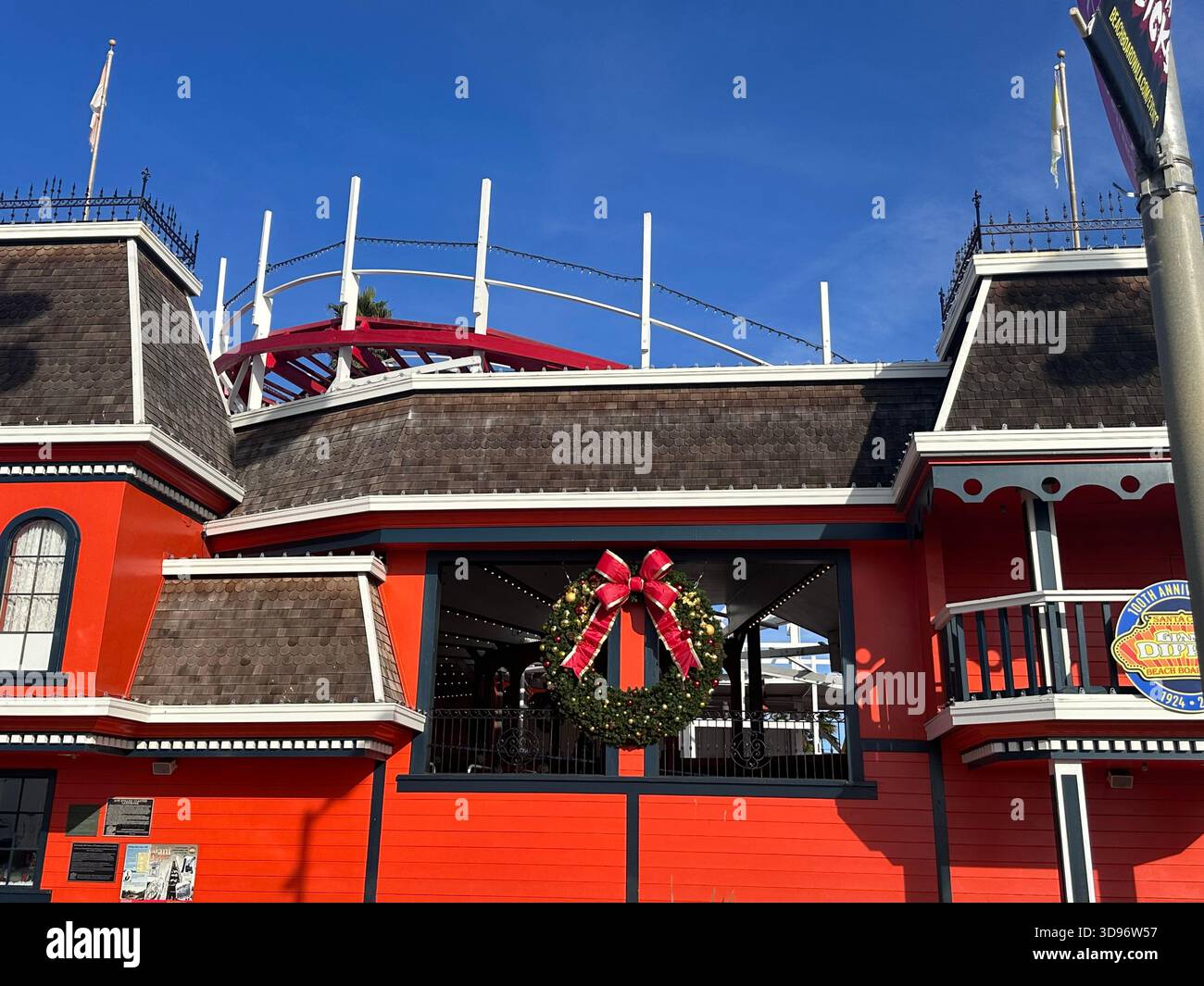 Christmas Wreath on Red Building at Santa Cruz Boardwalk - Smartphone Captured Stock Image